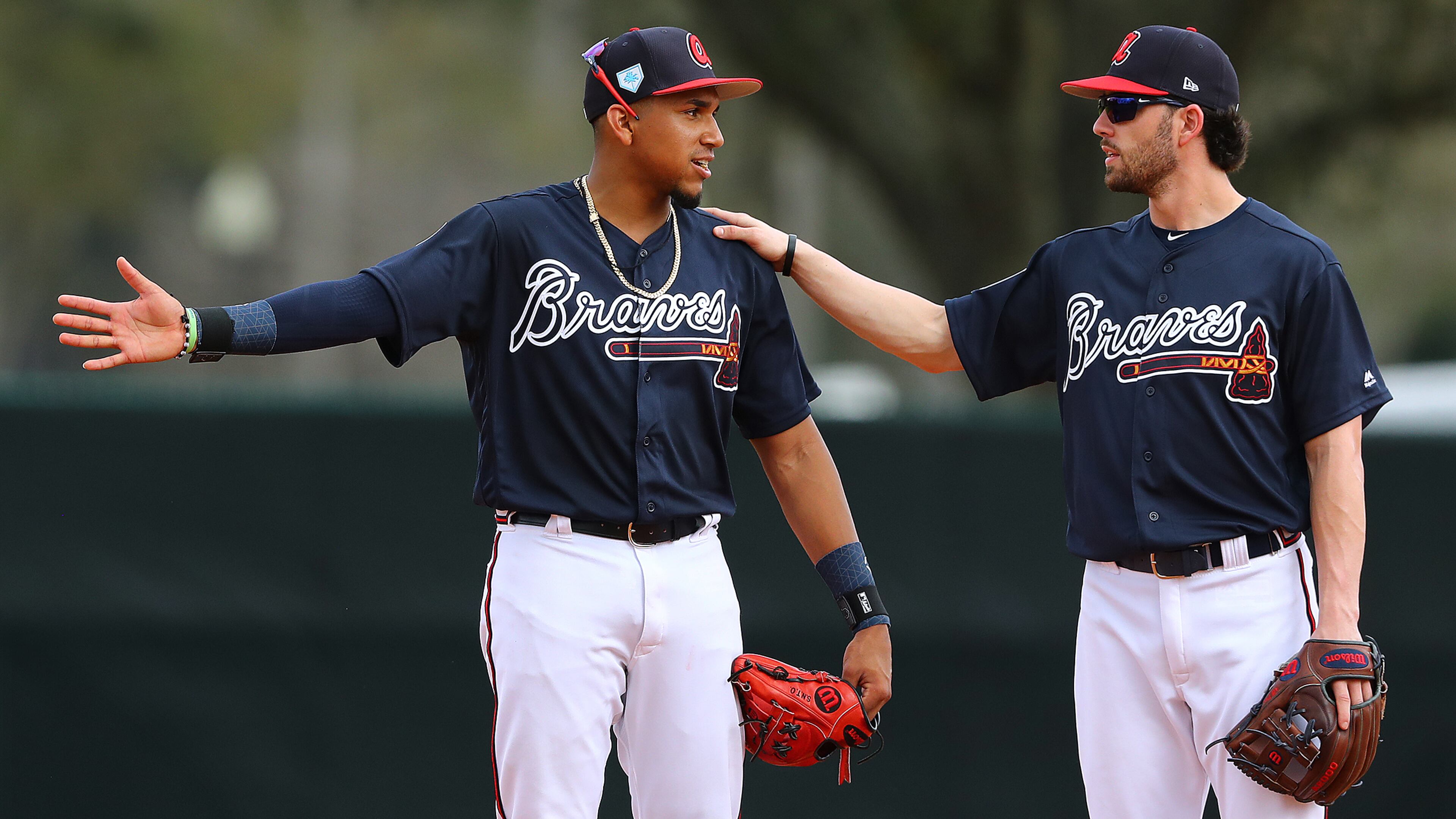 Atlanta Braves infielders Johan Camargo and Dansby Swanson work the infield together during the first full squad workout at spring training Thursday, Feb. 21, 2019, in the ESPN Wide World of Sports Complex in Lake Buena Vista, Fla.