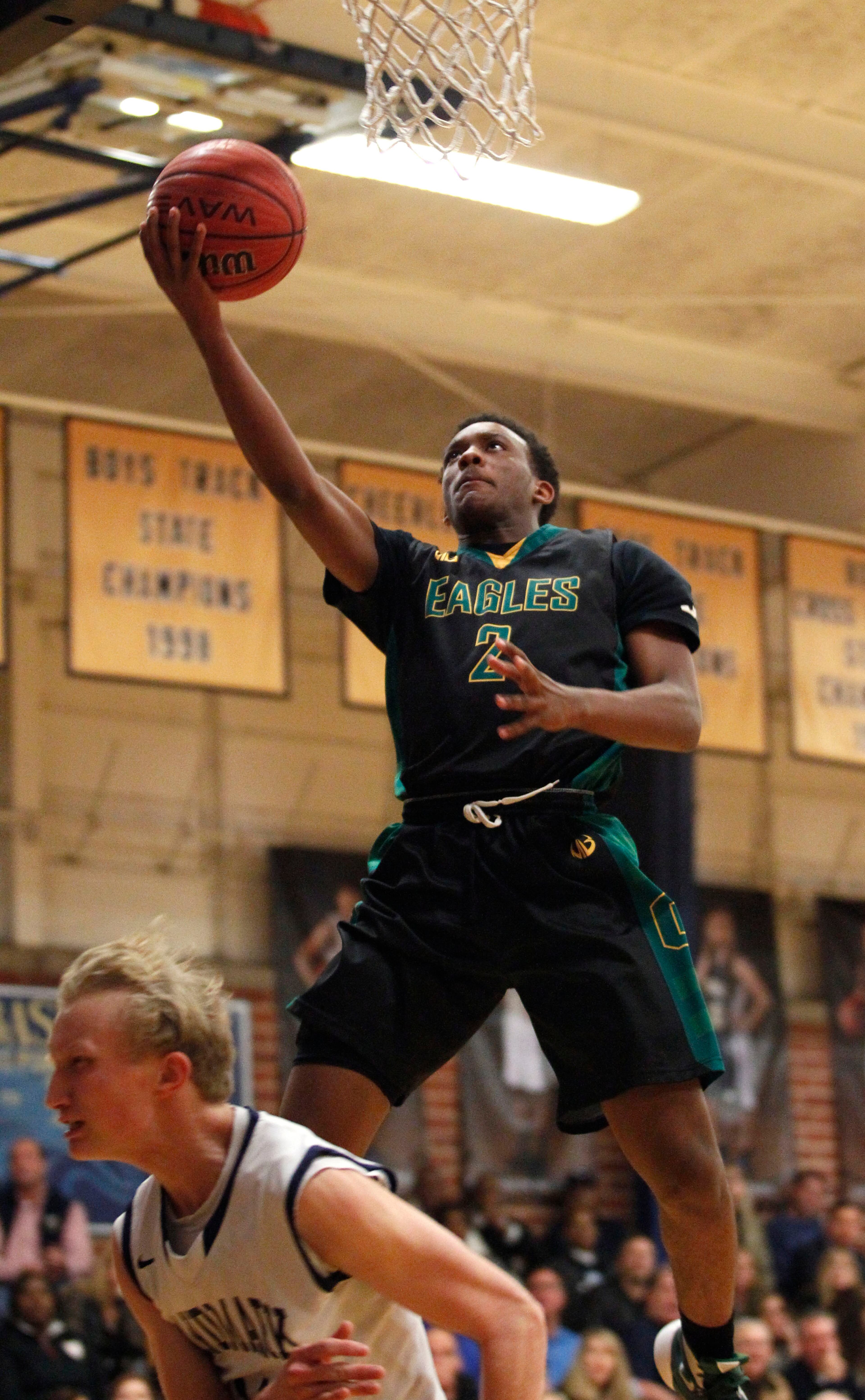 Greenforest Christian Janden Duggan (2) shoots a layup against Landmark ChristianNathan Burdette (11) at a high school basketball game at Landmark Christian school Friday, February 5, 2016. TAMI CHAPPELL/SPECIAL TO THE AJC