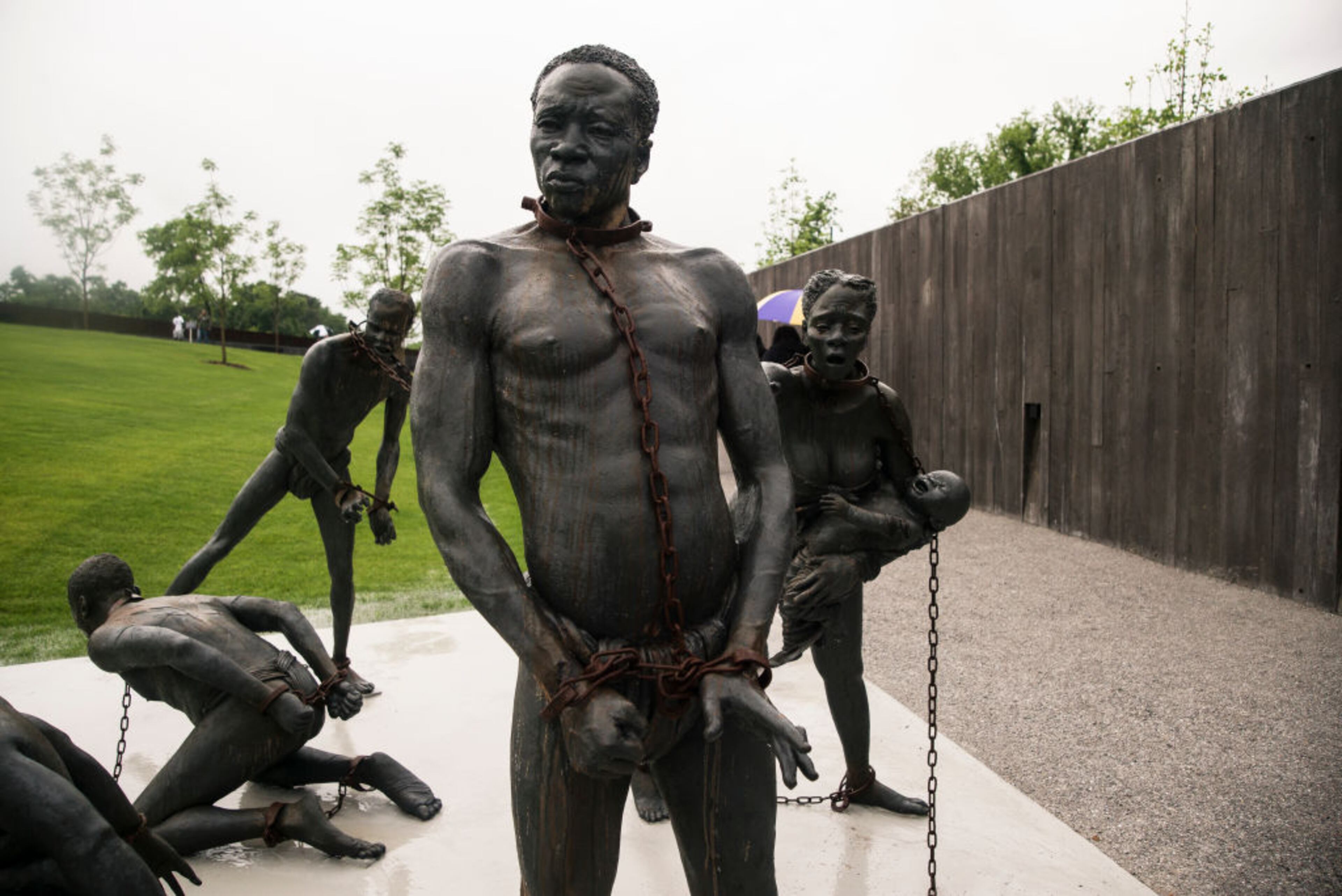 MONTGOMERY, AL - APRIL 26: A sculpture commemorating the slave trade greets visitors at the entrance National Memorial For Peace And Justice on April 26, 2018 in Montgomery, Alabama. The memorial is dedicated to the legacy of enslaved black people and those terrorized by lynching and Jim Crow segregation in America. Conceived by the Equal Justice Initiative, the physical environment is intended to foster reflection on America's history of racial inequality. (Photo by Bob Miller/Getty Images)