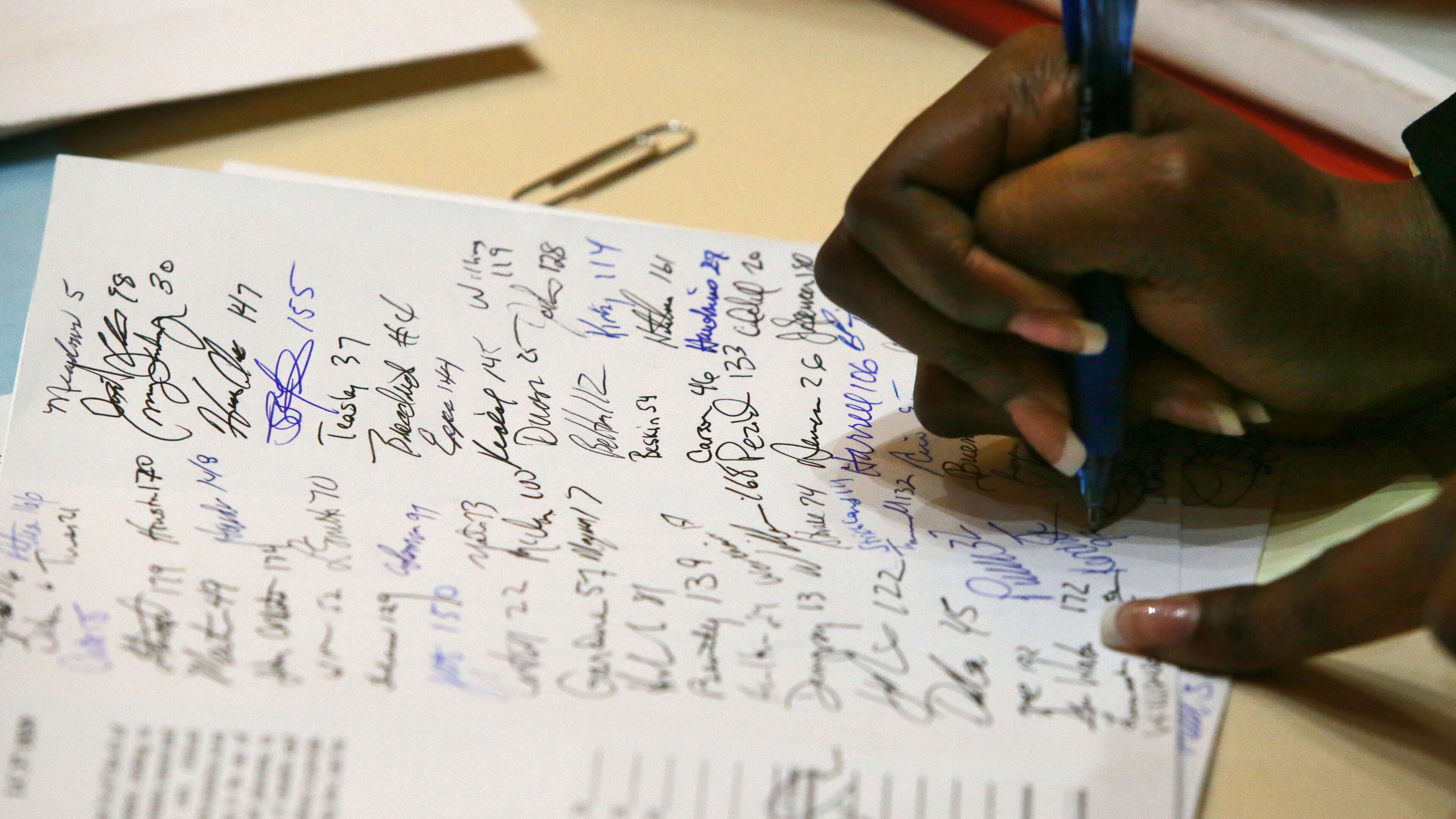 January 26, 2015 - Atlanta - Dar'shun Kendrick, D - Lithonia, was one of many house members that signed HB1 after Rep. Allen Peake promoted it during Morning Orders. Rep. Allen Peake, R-Macon, officially introduced House Bill 1 on Monday. HB 1 is his medical marijuana bill, which has been denuded after negotiations with Gov. Nathan Deal. Instead of creating a state program to grow and cultivate the cannabis oil, Peake’s bill will only offer immunity from prosecution for Georgians who legally possess the drug, which may be used under the proposal for a variety of disorders. BOB ANDRES / BANDRES@AJC.COM Dar'shun Kendrick,D - Lithonia, was one of many House members who signed H.B. 1, Allen Peake’s medicinial marijuana bill, on Monday. Bob Andres,bandes@ajc.com