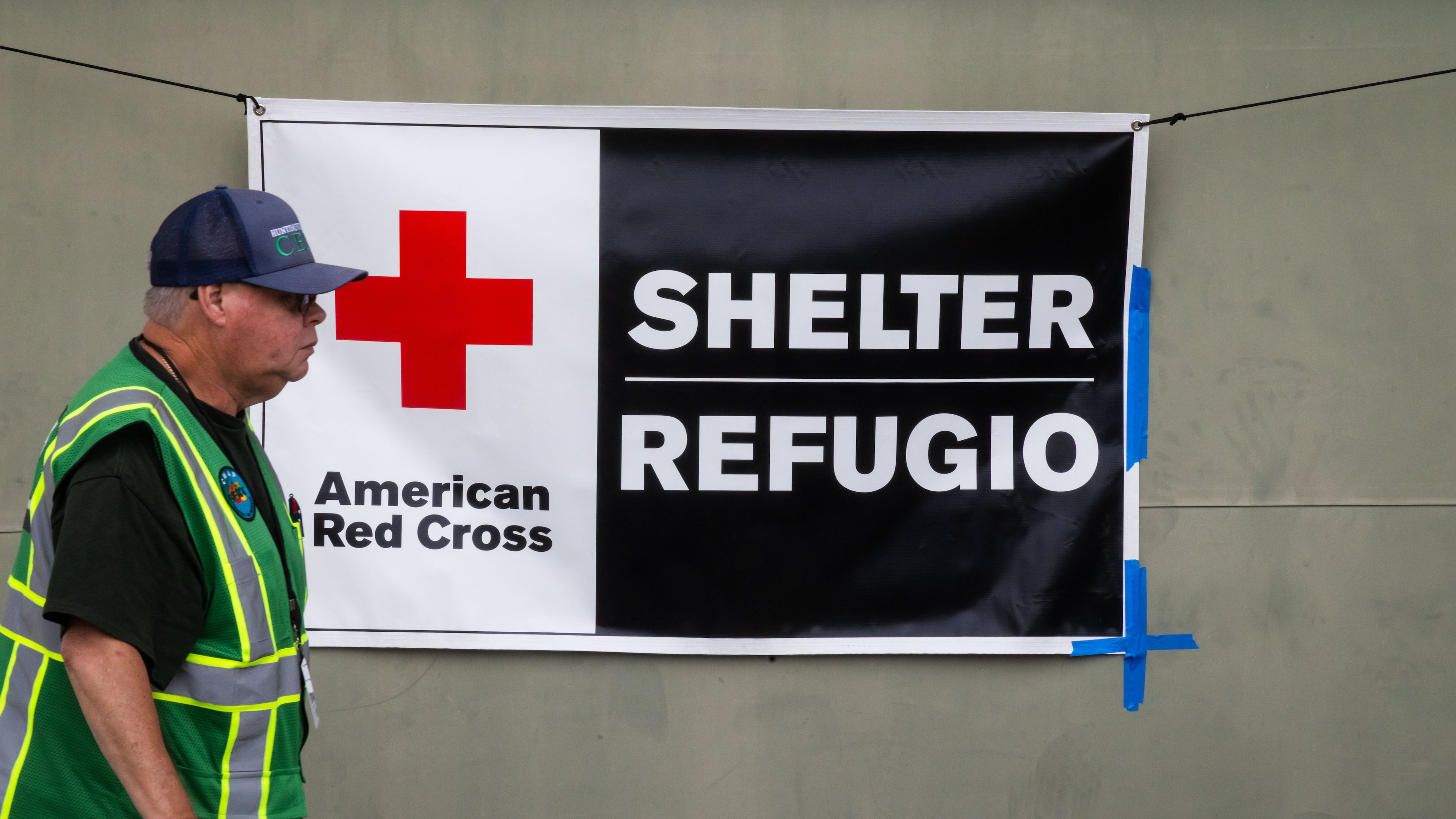 An American Red Cross volunteer walks outside Freedom Hall, an evacuation center in Fountain Valley, Calif.,on Monday, May 25, 2026. (AP Photo/Ethan Swope)