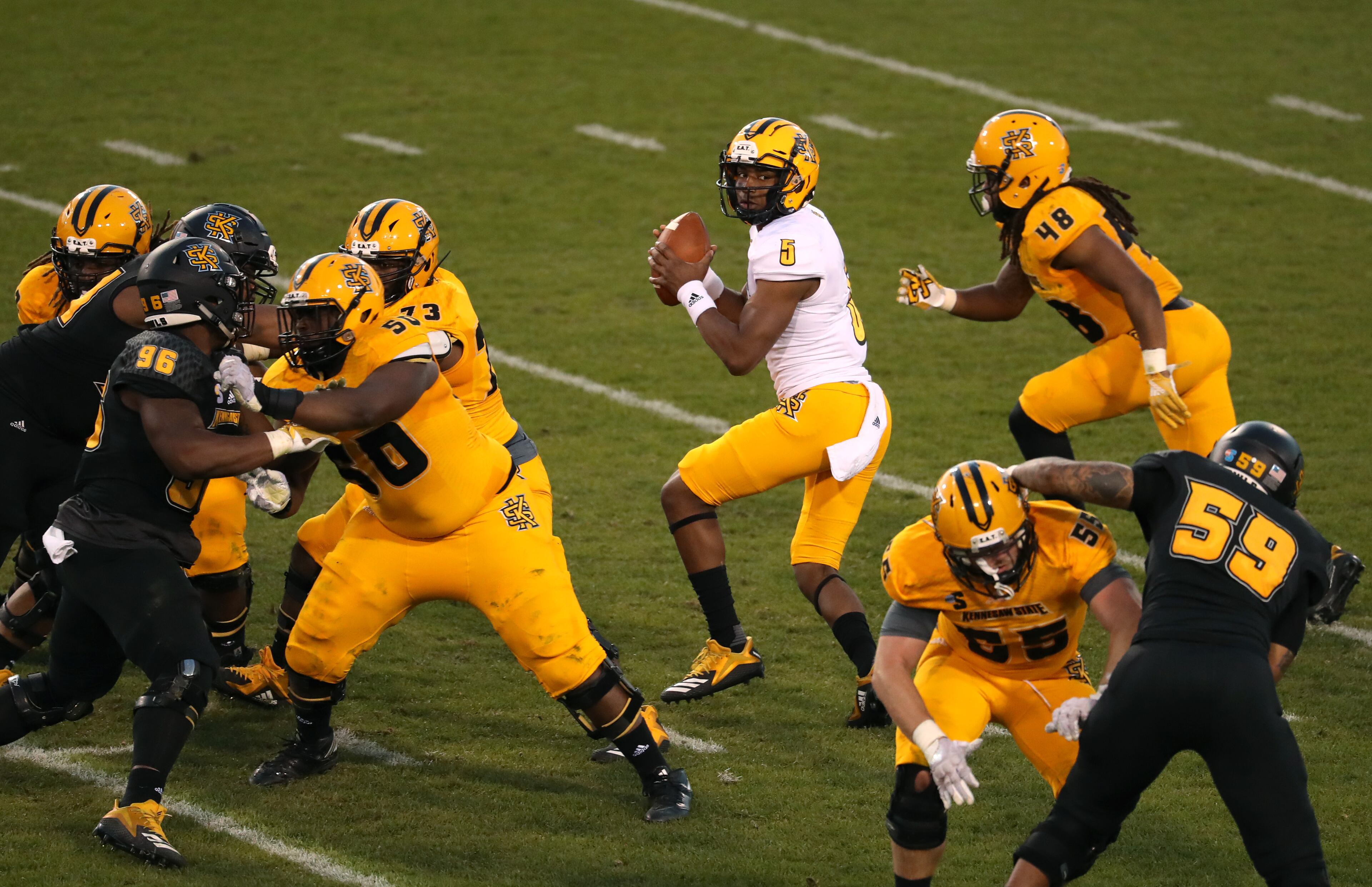 March 22, 2019 - Kennesaw, Ga: Kennesaw State Owls quarterback Tommy Bryant (5) runs a play during the KSU spring football game at Fifth Third Bank Stadium Friday, March 22, 2019 in Kennesaw, Ga.. (JASON GETZ/SPECIAL TO THE AJC)