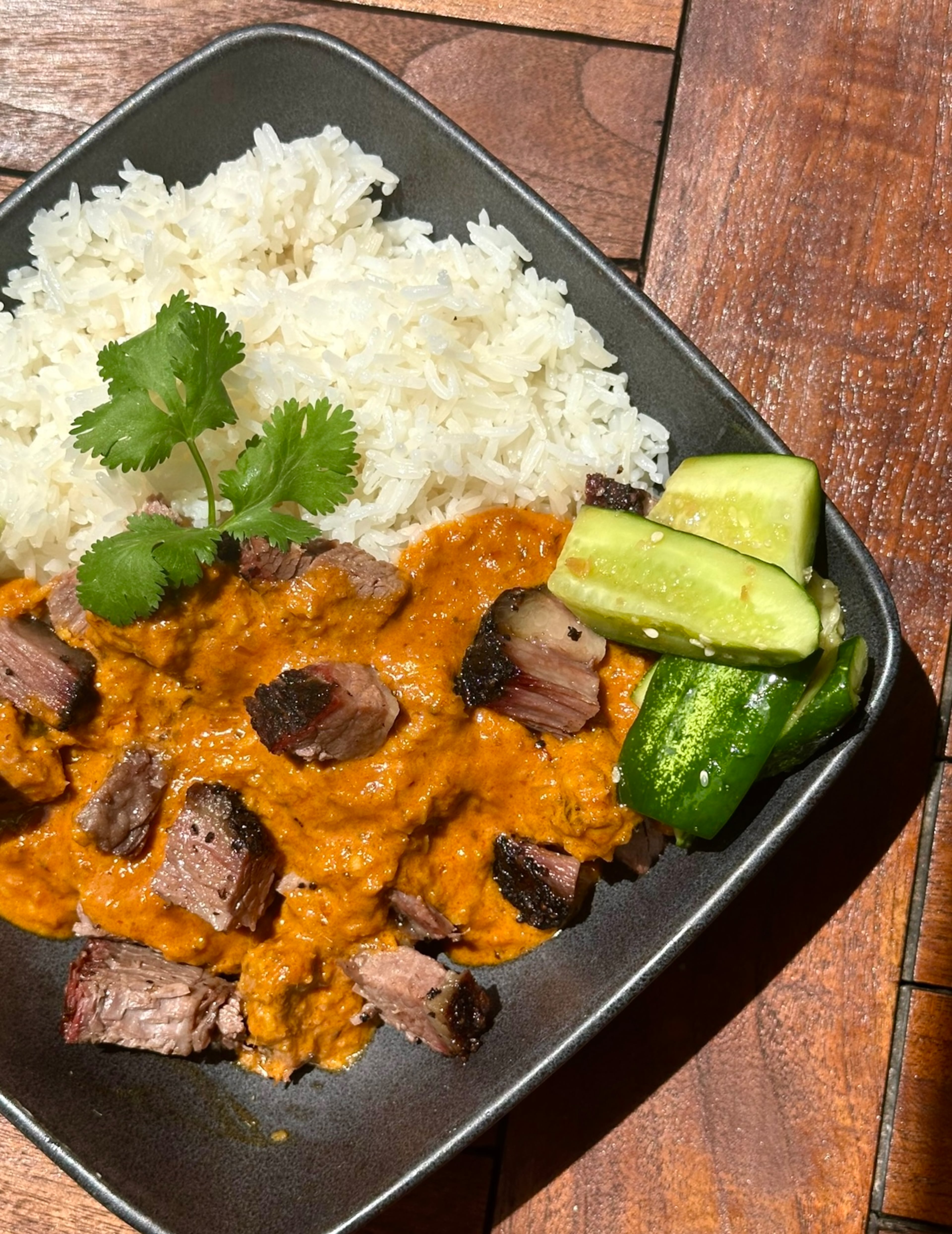 Sweet Auburn Barbecue, the site of the upcoming Good Luck Smoke Show food festival, prepares a smoked brisket rendang. (Courtesy of MJT & Co.)