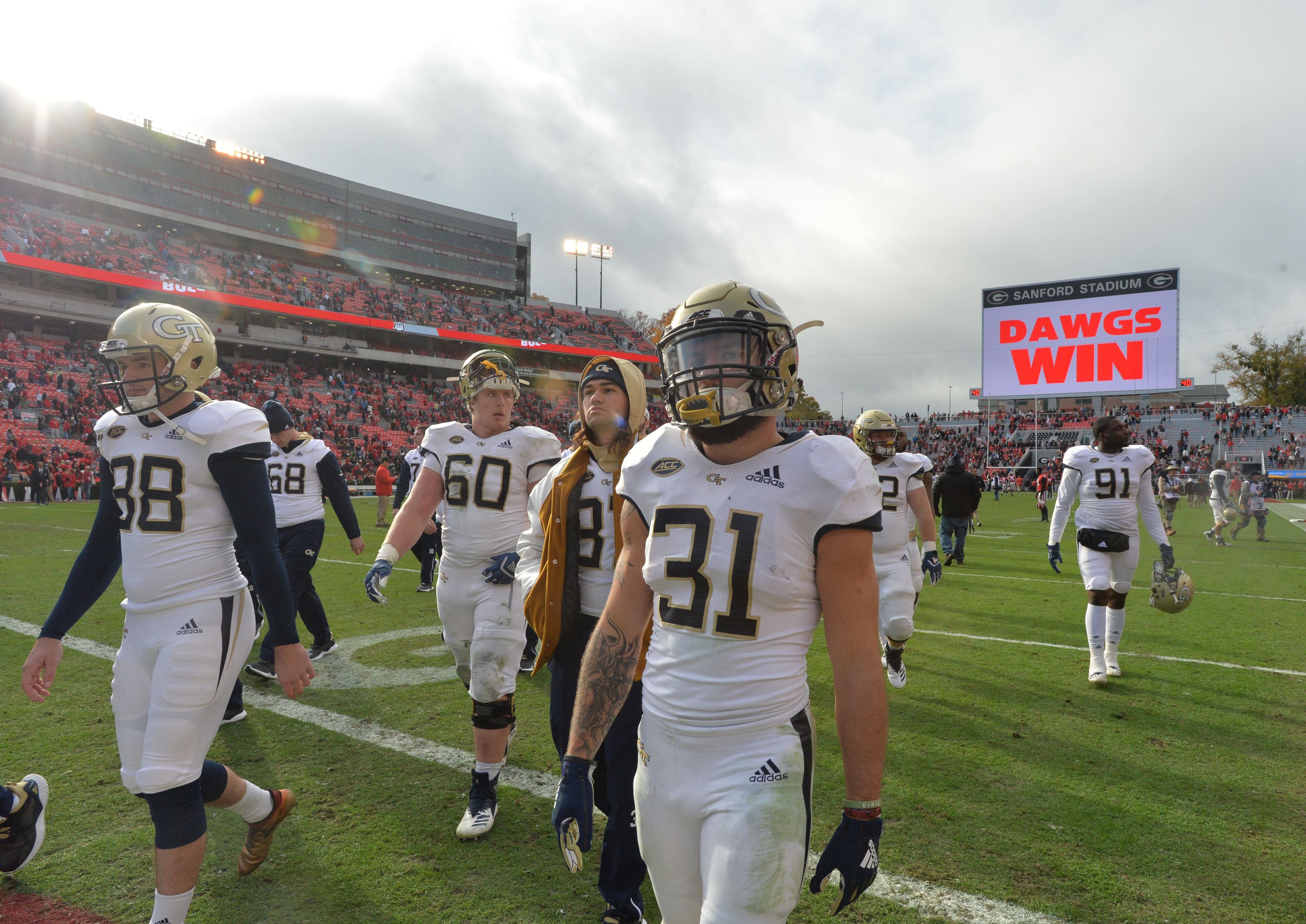 November 24, 2018 Athens - Georgia Tech players leave the football field after Georgia defeated the Georgia Tech in a NCAA college football game at Sanford Stadium on Saturday, November 24, 2018. Georgia won 45 - 21 over the Georgia Tech. HYOSUB SHIN / HSHIN@AJC.COM