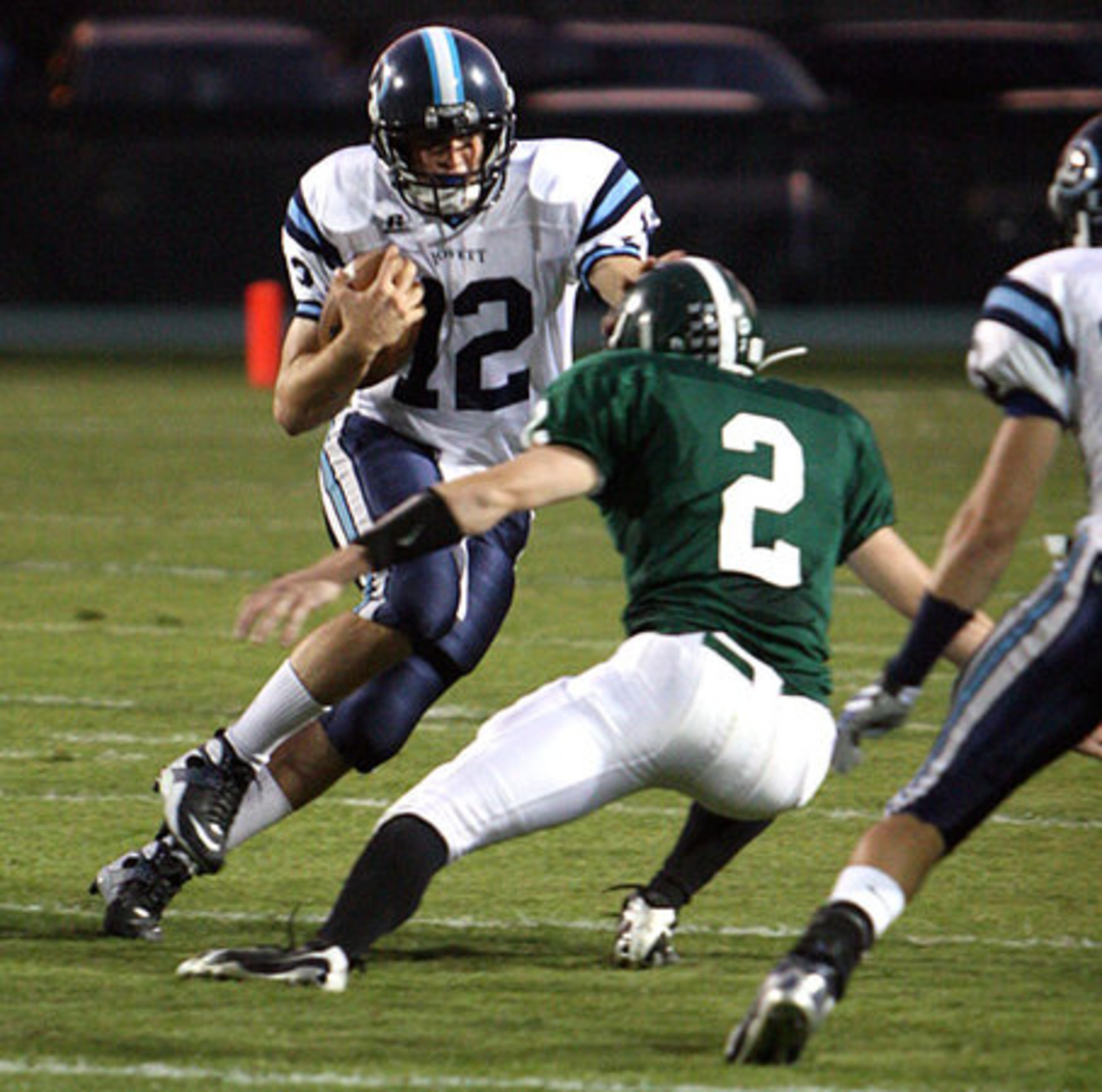 Lovett's Jonathan Carkhuff (12) puts a move on Westminster's William Bridges (2).