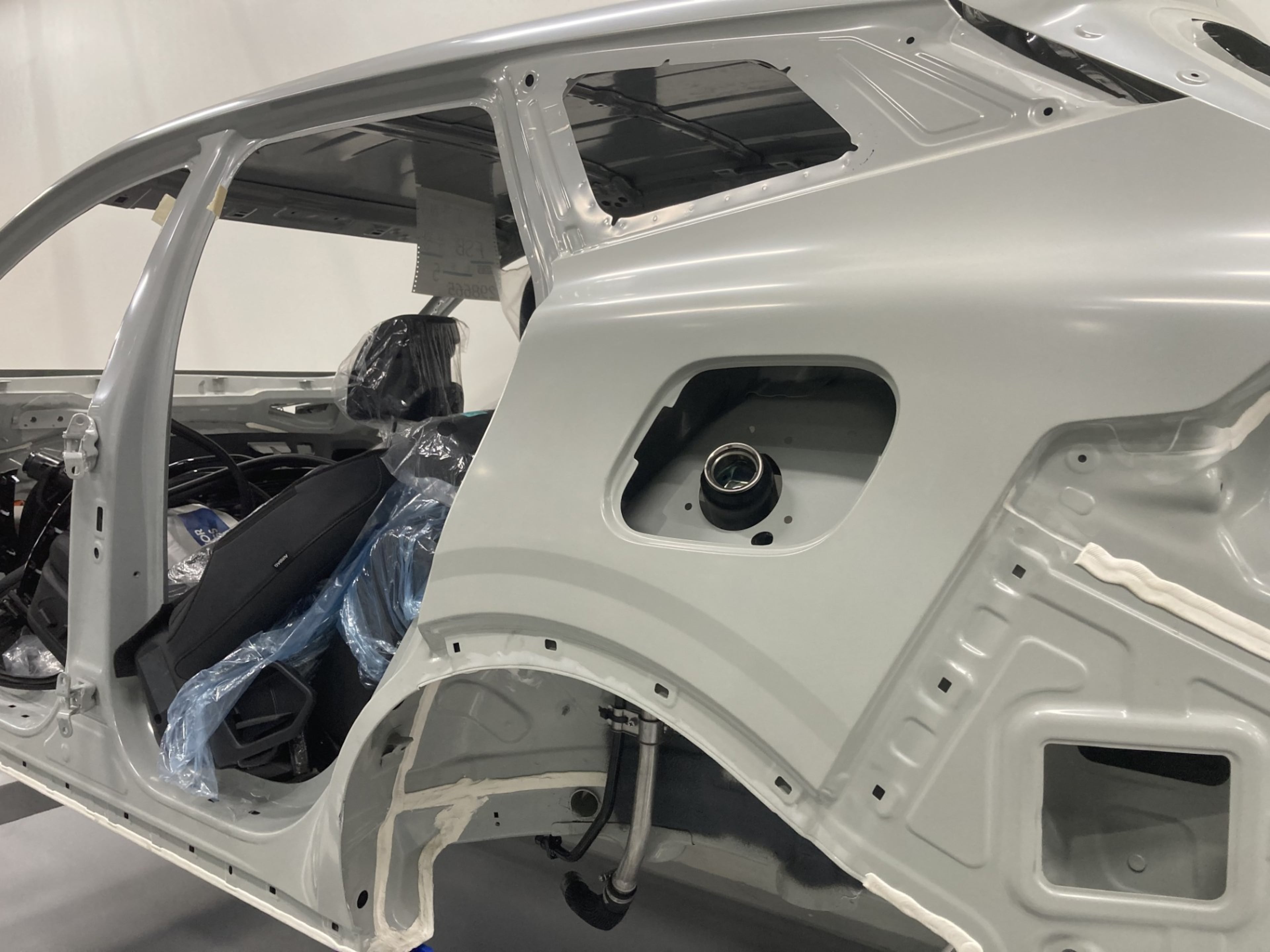 The Kia Sportage hybrid is built with something no other vehicle manufactured at the Hyundai Metaplant includes: a fuel fill intake. The other two models built at the factory near Savannah are all-electric plug-ins. (Adam Van Brimmer/AJC)