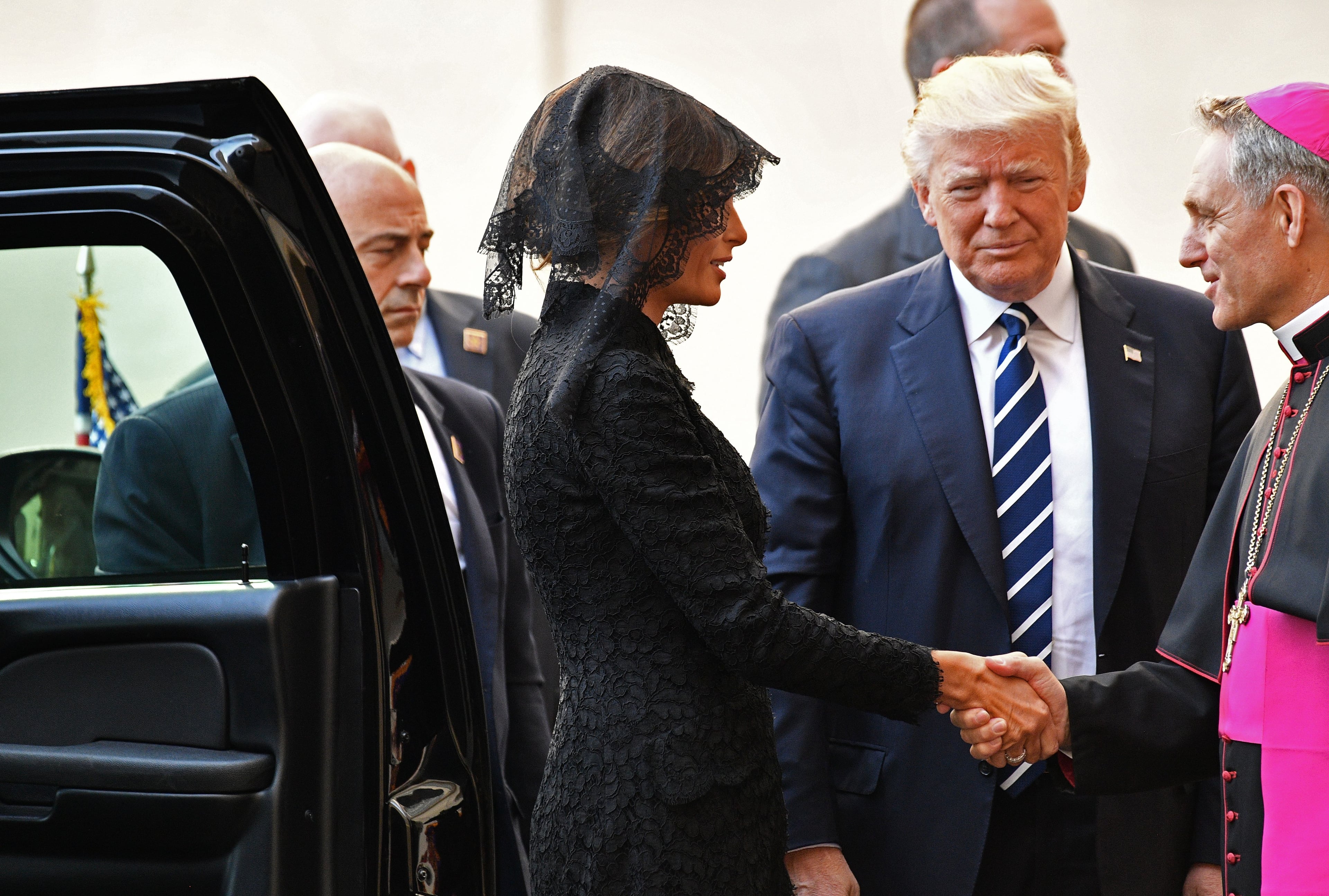 US President Donald Trump (C) and his wife Melania are welcomed by the prefect of the papal household Georg Gaenswein as they arrive at the Vatican for a private audience with Pope Francis on May 24, 2017. / AFP PHOTO / Vincenzo PINTO (Photo credit should read VINCENZO PINTO/AFP/Getty Images)