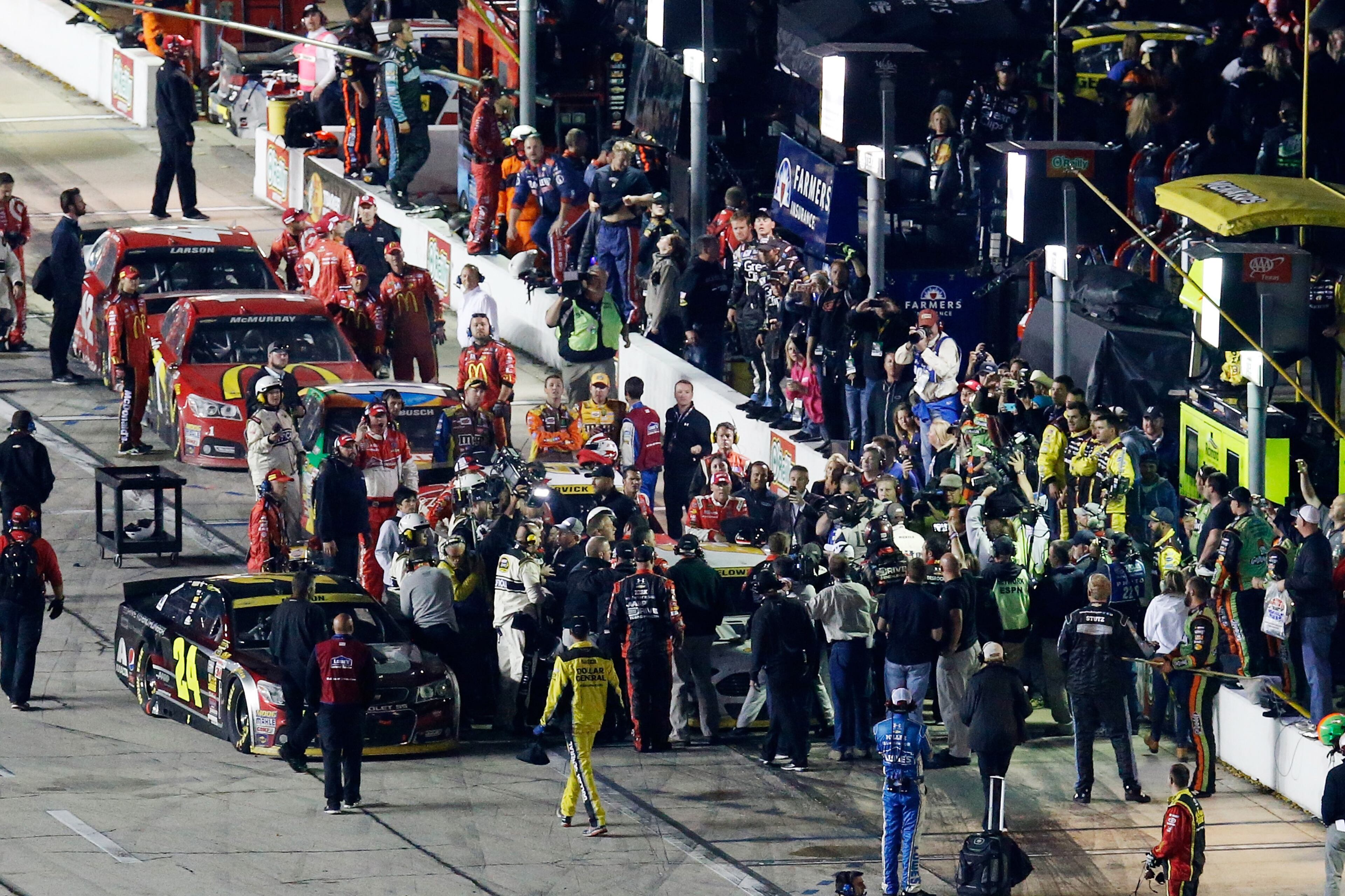 FORT WORTH, TX - NOVEMBER 02: Jeff Gordon, driver of the #24 Drive To End Hunger Chevrolet, walks to confront Brad Keselowski, driver of the #2 Miller Lite Ford, following the NASCAR Sprint Cup Series AAA Texas 500 at Texas Motor Speedway on November 2, 2014 in Fort Worth, Texas. (Photo by Brian Lawdermilk/Getty Images)