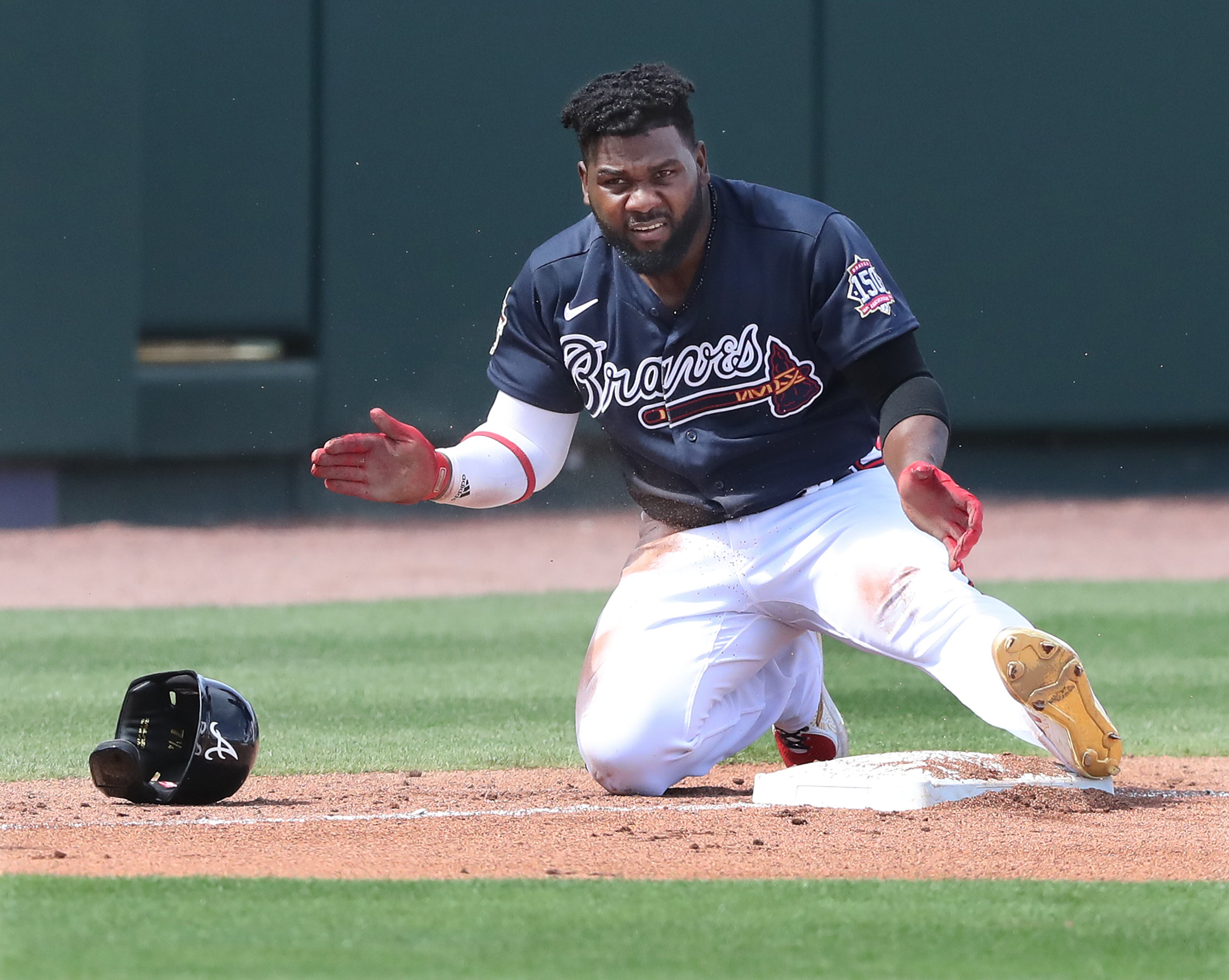 Braves' Abraham Almonte claps his hands after a leadoff triple against the Minnesota Twins during the second inning. Curtis Compton / Curtis.Compton@ajc.com”