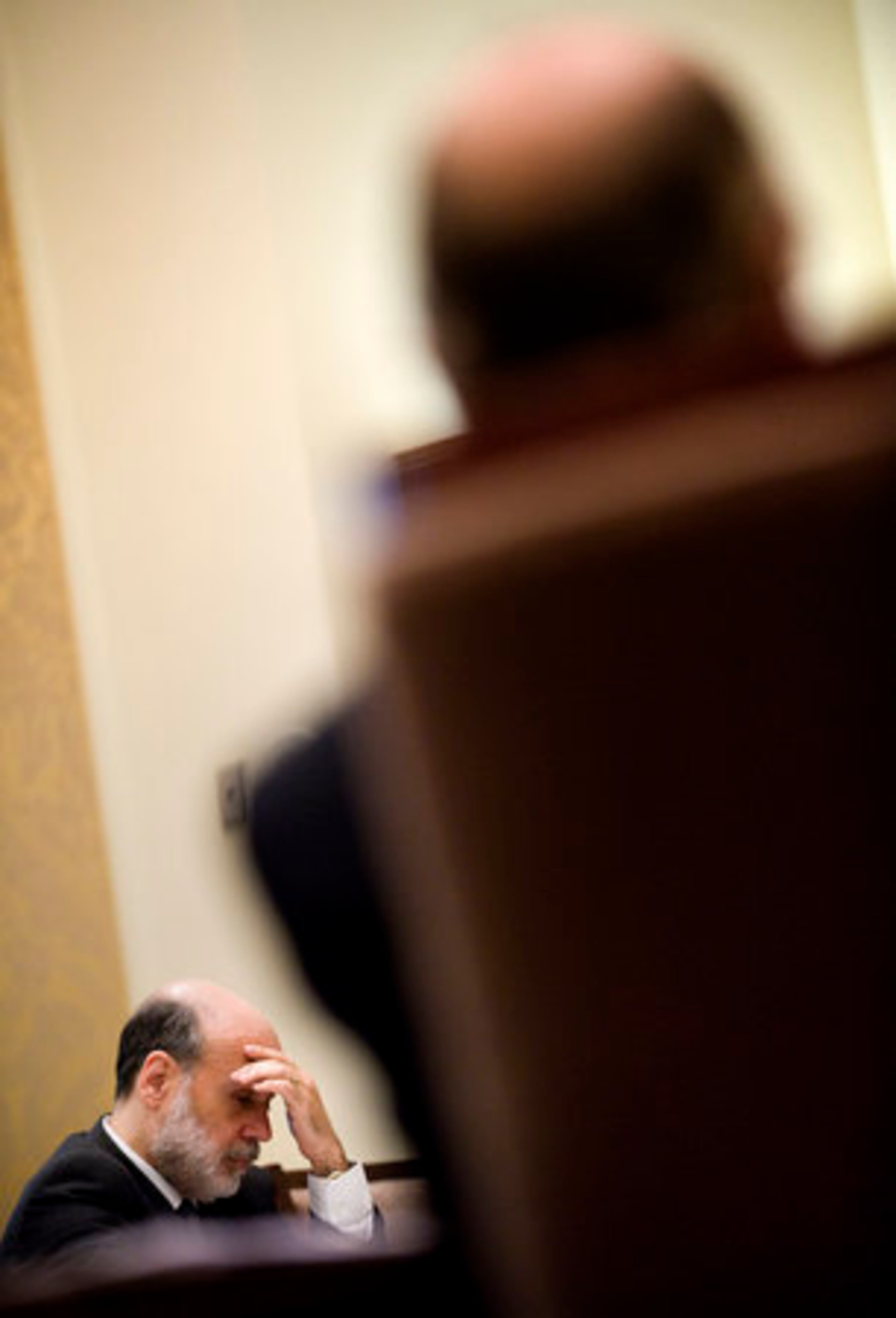 Ben Bernanke, chairman of the Federal Reserve, reflects during a board meeting in Washington on Monday. The Federal Reserve made public new rules for mortgage lending, intended to prevent the kinds of abuses seen in subprime lending that forced some $400 billion in bank write-offs.