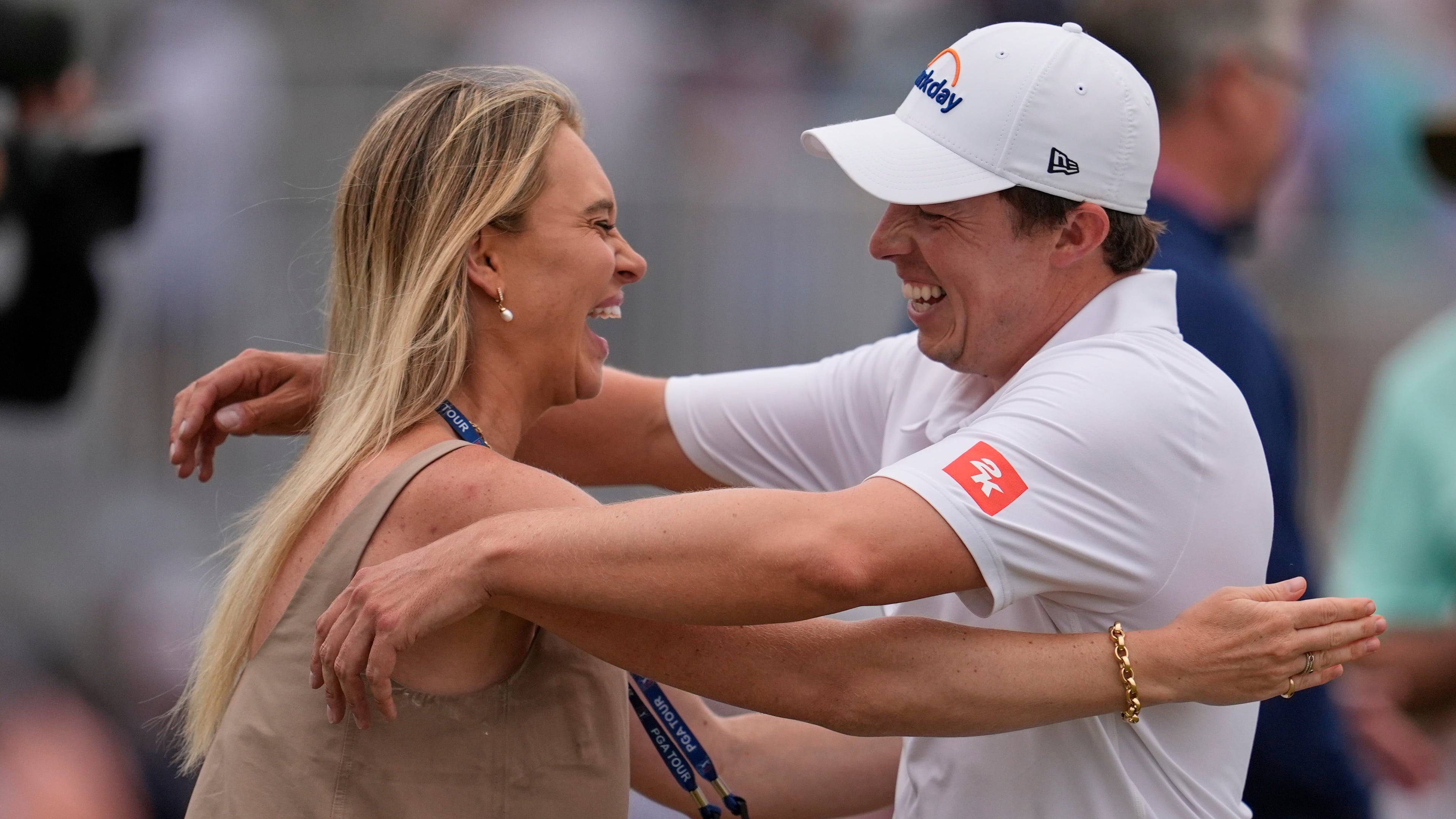 Matt Fitzpatrick, of England, right, hugs his wife Katherine Gaal after winning the RBC Heritage golf tournament Sunday, April 19, 2026, in Hilton Head, S.C. (AP Photo/Mike Stewart)