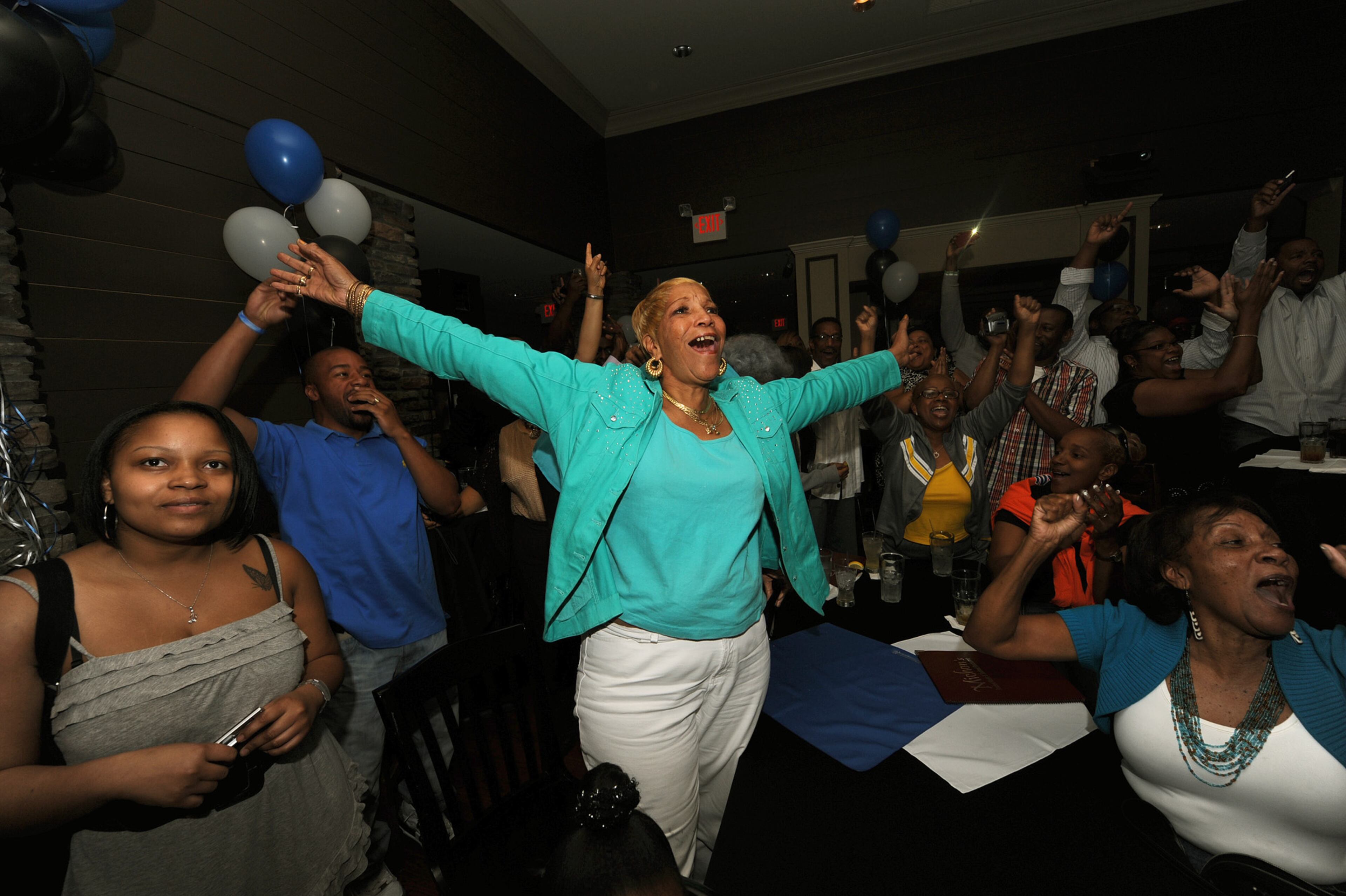 Rosa Graves, Cam Newton's aunt, (center) celebrates inside Michon's Restaurant after Cam Newton was selected the first pick in the 2011 NFL Draft on Thursday, Apr 28, 2011. Johnny Crawford jcrawford@ajc.com