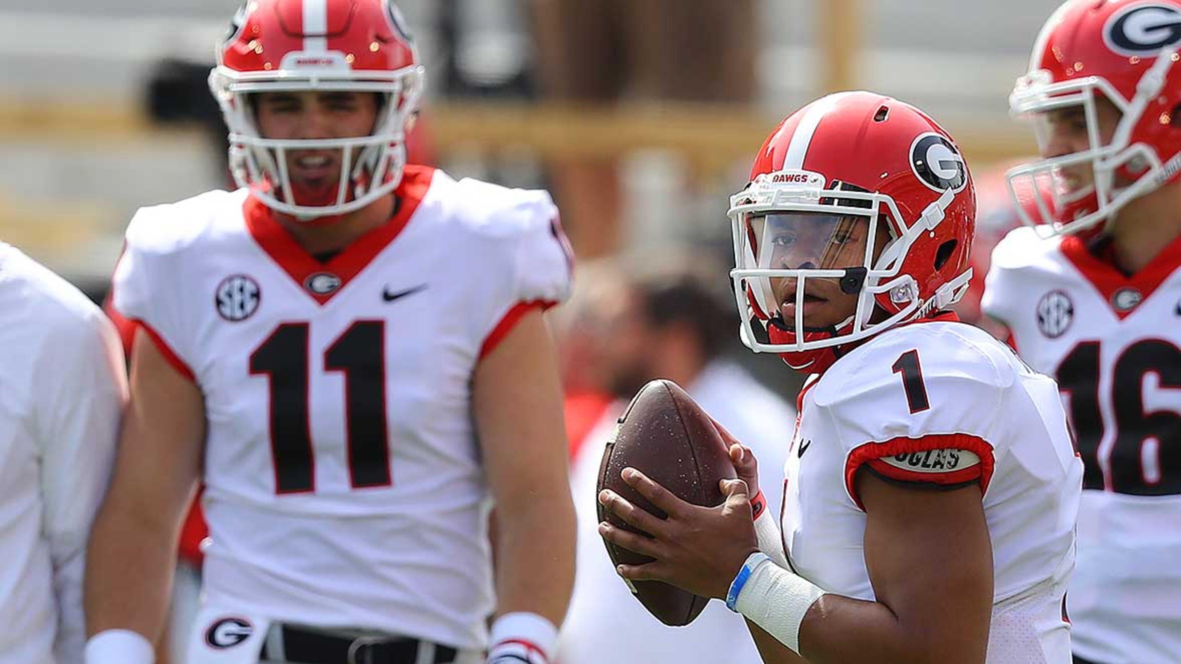 Quarterbacks Jake Fromm (11) and Justin Fields (1) prepare for Saturday's G-Day game at Sanford Stadium in Athens. (Curtis Compton/ccompton@ajc.com)