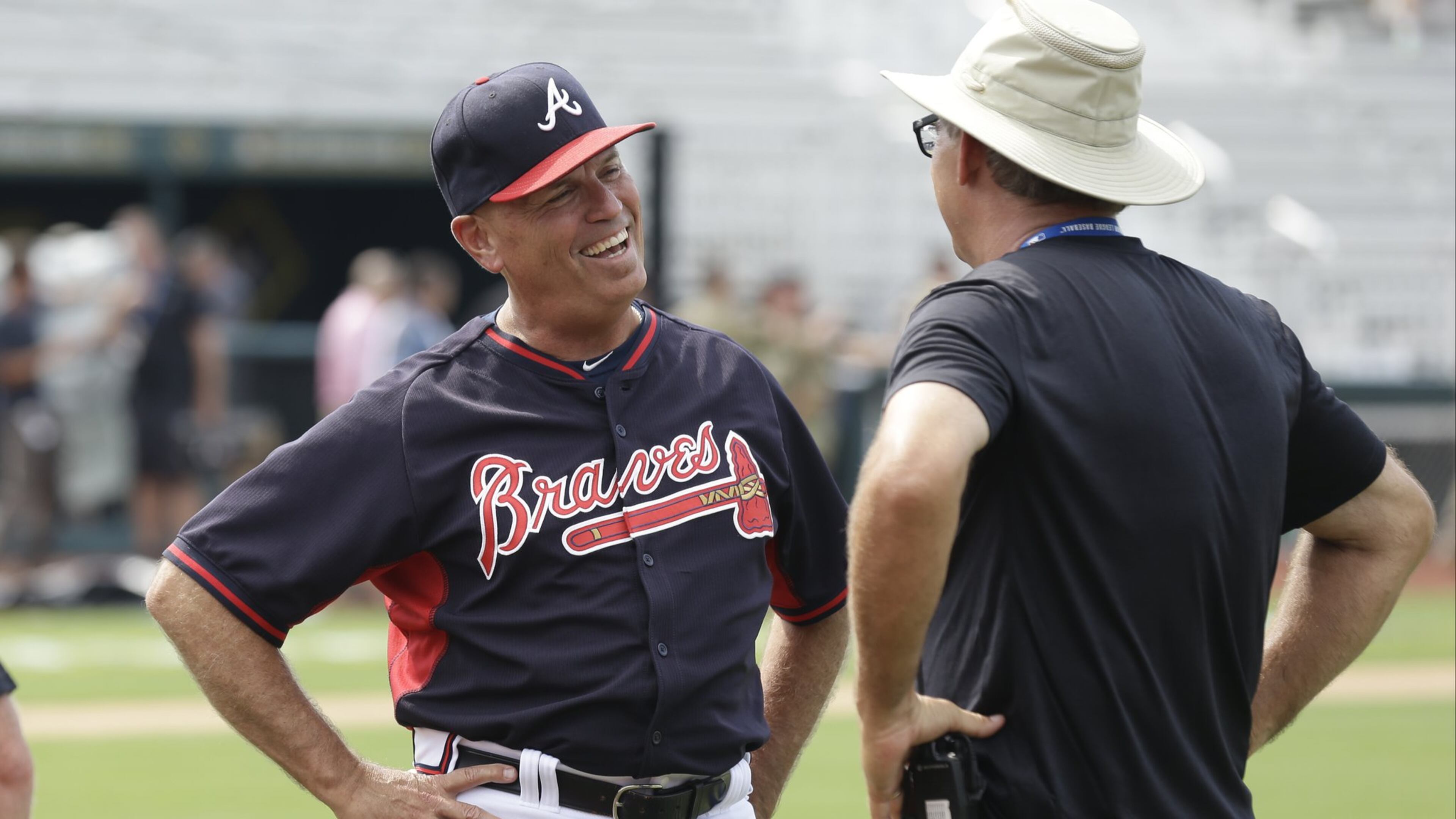 Braves interim manager Brian Snitker smiles before a game between the Marlins and the Braves in Fort Bragg, N.C., Sunday, July 3, 2016. (AP Photo/Gerry Broome)