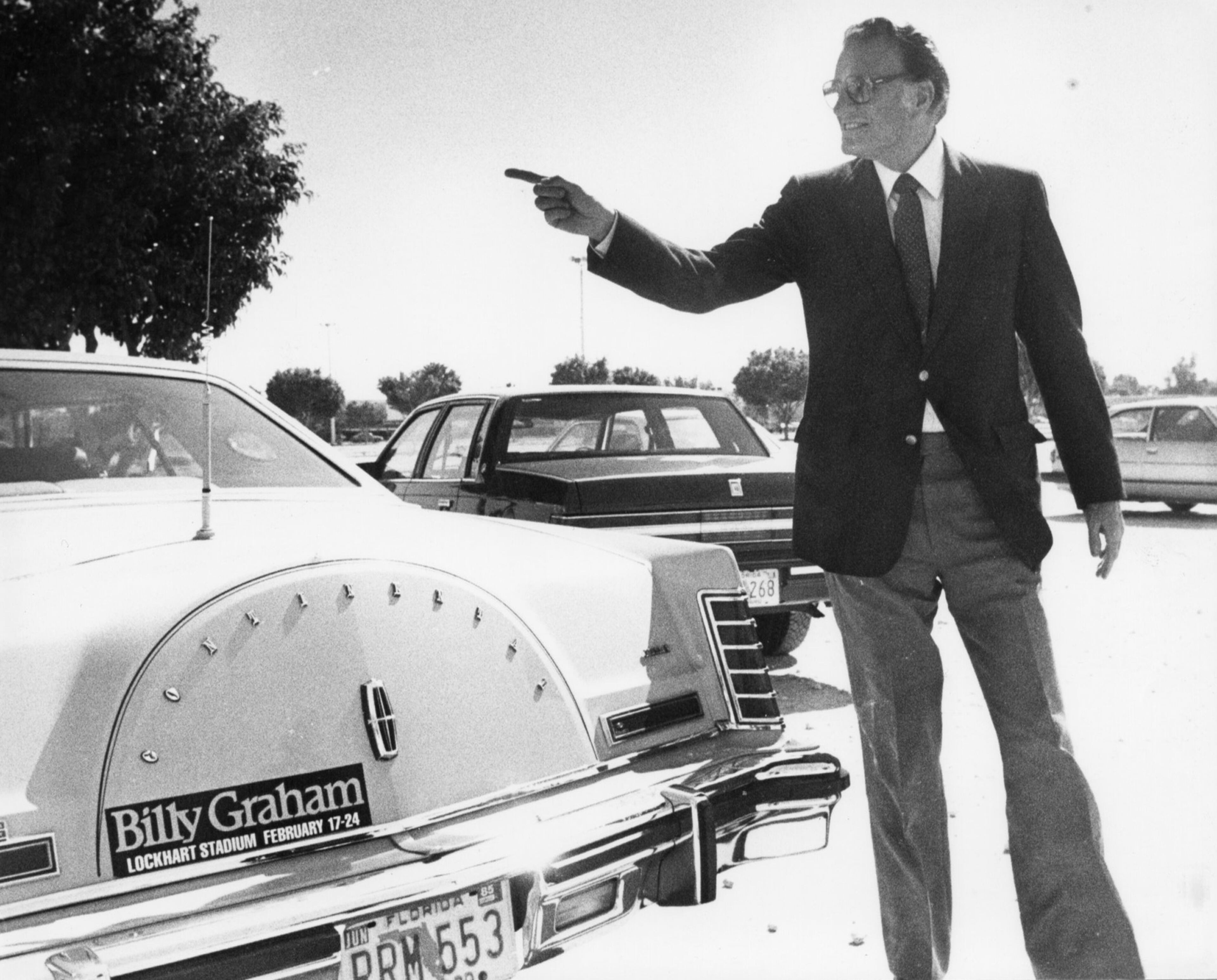 The Rev. Billy Graham stands next to a Lincoln Continental displaying a bumper sticker for his appearances at Lockhart Stadium in Fort Lauderdale in 1985. Thirteen years after the last Continental rolled off a Michigan assembly line, Ford Motor Co. is debuting the new Continental in concept form at the New York Auto Show on Monday, March 30, 2015. The production version goes on sale next year. (The Palm Beach Post / File Photo)
