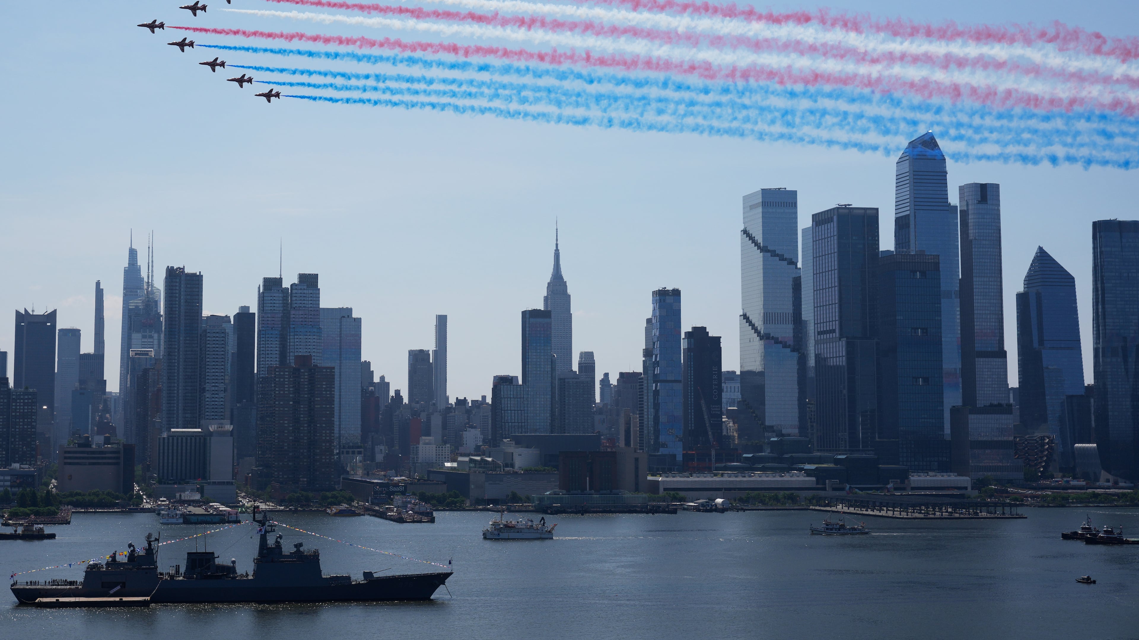 Military planes perform a flyover of the Hudson River, above the the Manhattan skyline, as seen from Weehawken, N.J., Saturday, July 4, 2026. (AP Photo/Seth Wenig)