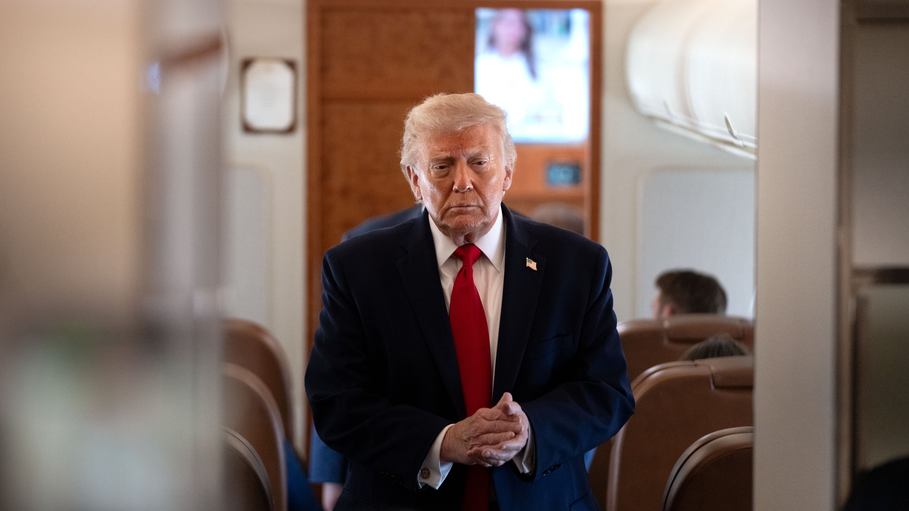 President Donald Trump arrives to speak to reporters aboard Air Force One en route from Joint Base Andrews, Md., to Eau Claire, Wis., Friday, June 5, 2026. (AP Photo/Mark Schiefelbein)