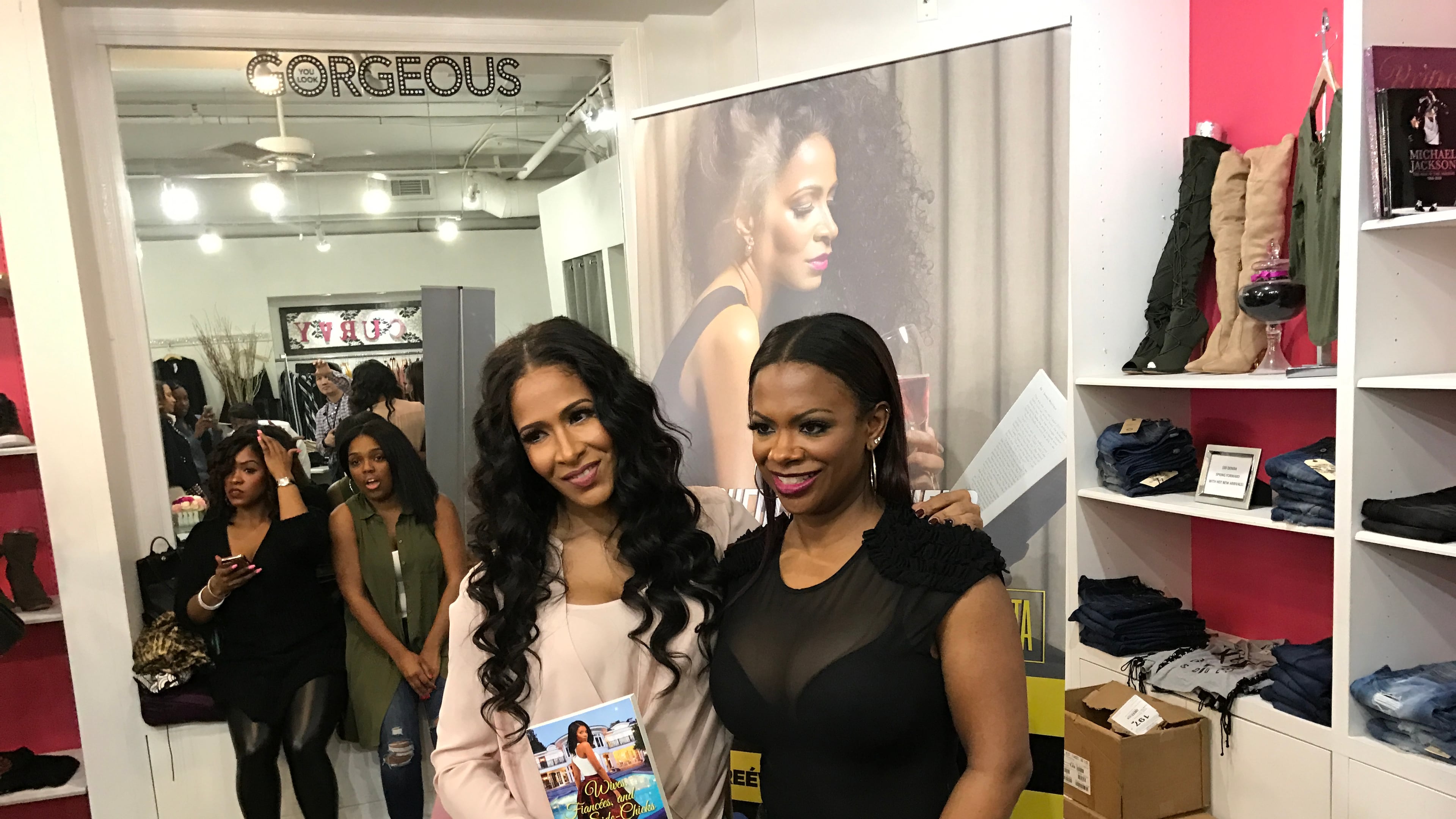 Sheree Whitfield and Kandi Burruss pose after her book signing at Kandi's TAGS Boutique in Buckhead March 5, 2017. CREDIT: Rodney Ho/ rho@ajc.com