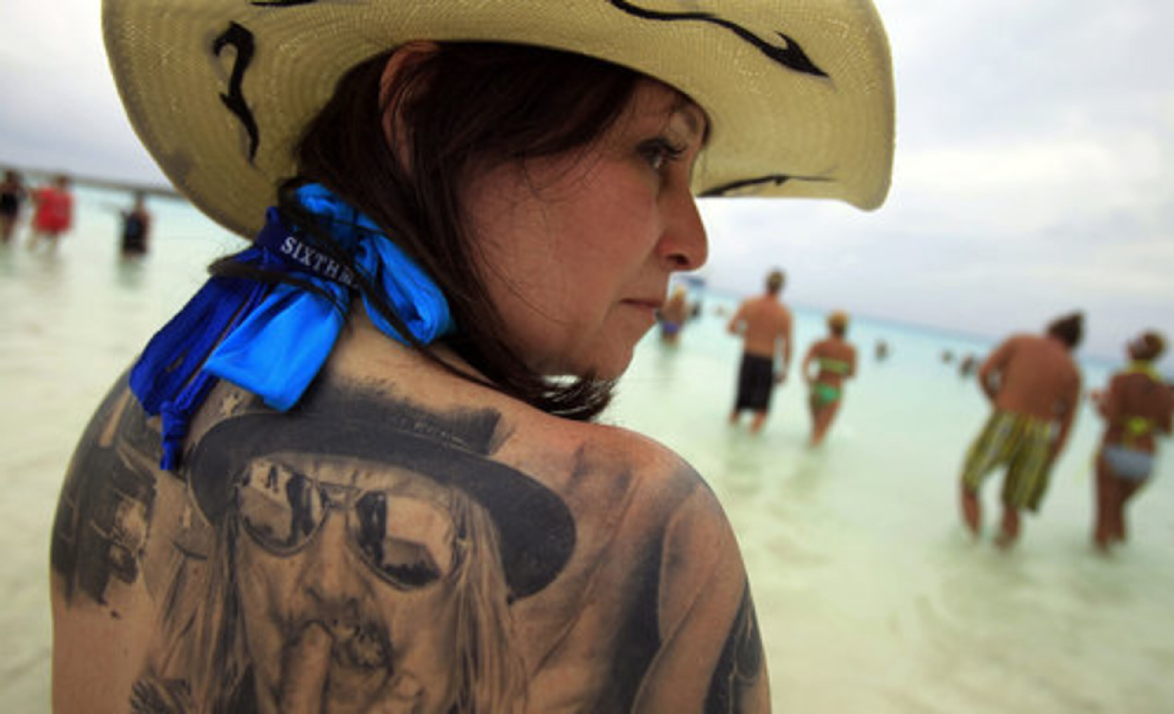 Roxie Decambra shows one of the many Kid Rock tattoos. Dedicated fans paid between $800 and $4,000 for a ticket -- minus airfare, fees and drinks -- for the four-day cruise from Miami to the Bahamas.