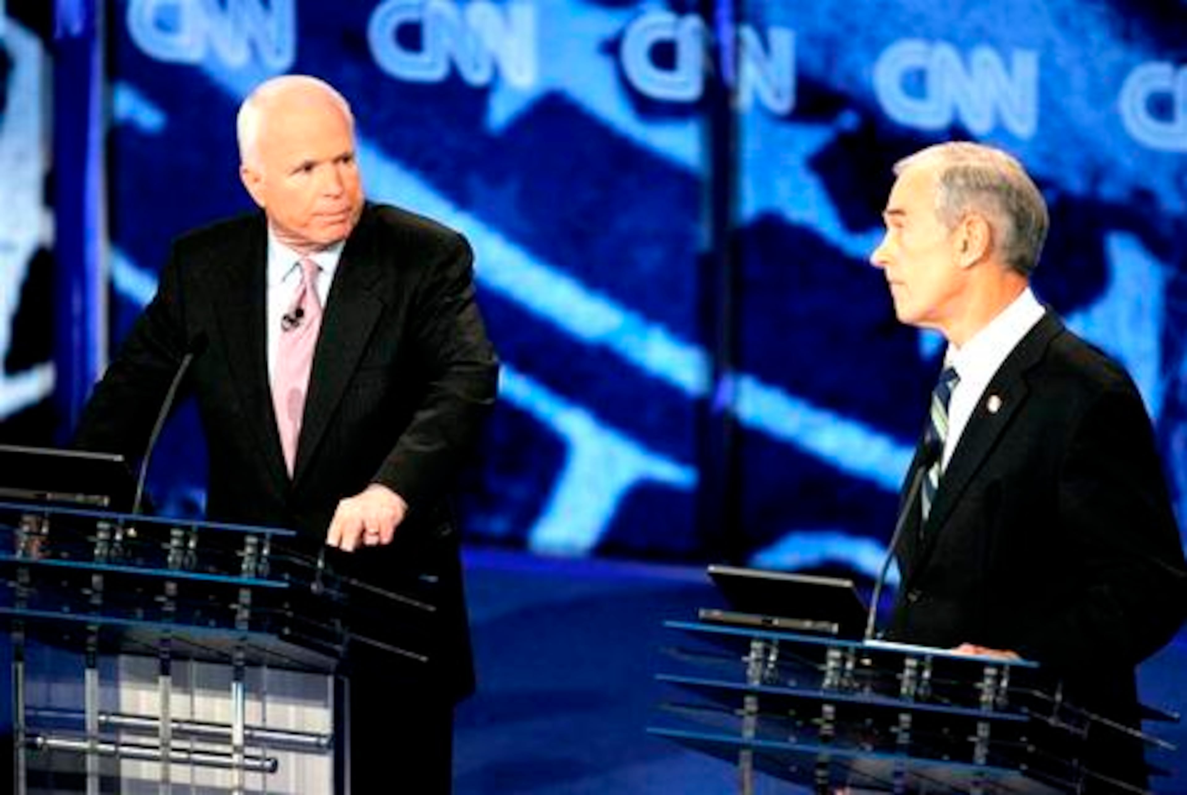 Republican presidential hopeful, Sen. John McCain, R-Ariz., left, exchanges a point with Republican presidential hopeful, Rep. Ron Paul, R-Texas, during the CNN YouTube Republican party presidential debate Wednesday, Nov. 28, 2007 at the Mahaffey Theater in St. Petersburg, Fla.