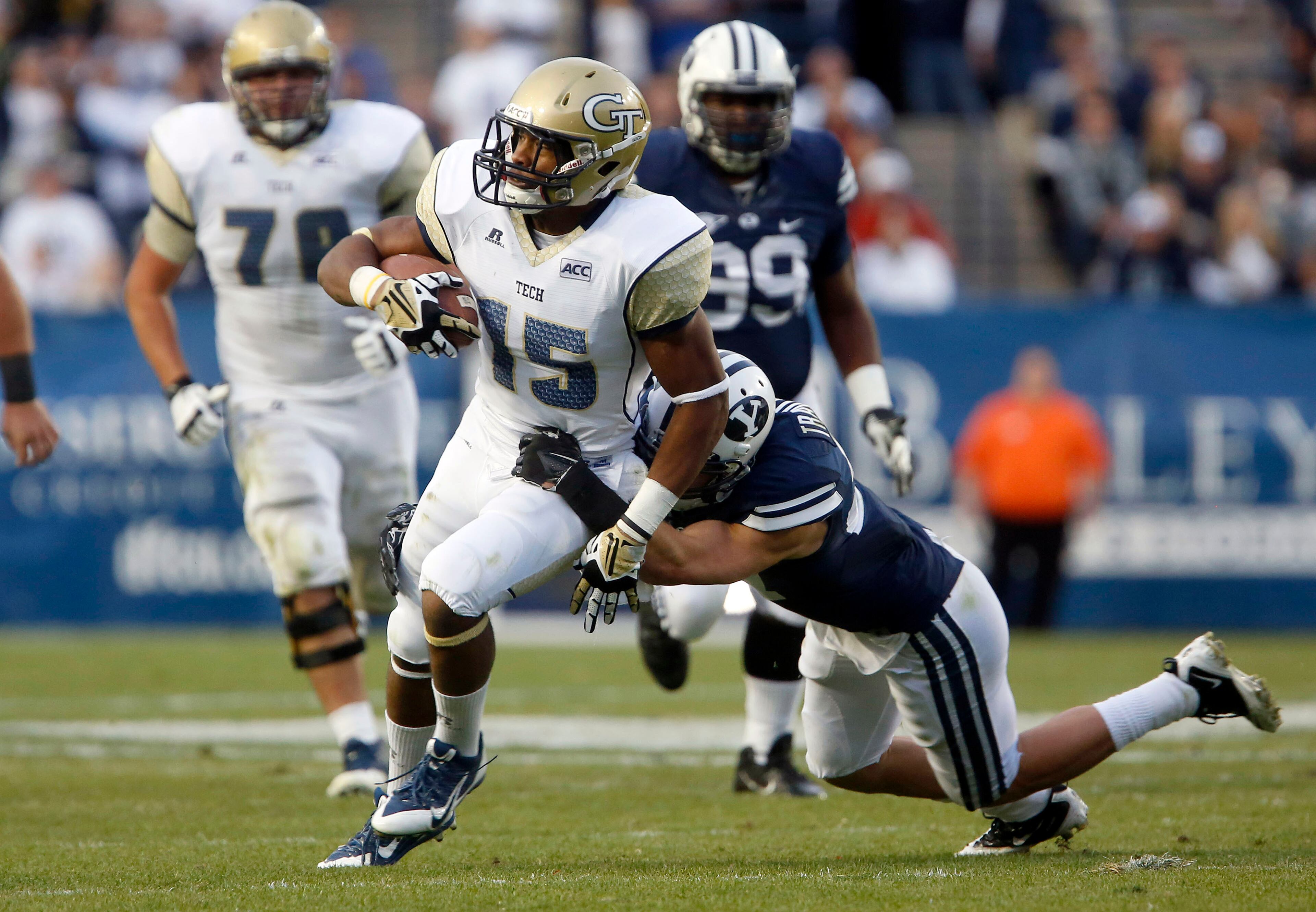 Oct 12, 2013; Provo, UT, USA; Brigham Young Cougars defensive back Blake Morgan (27) attempts to tackle Georgia Tech Yellow Jackets wide receiver DeAndre Smelter (15) during the second quarter of a football game at Lavell Edwards Stadium.Jim Urquhart-USA TODAY Sports