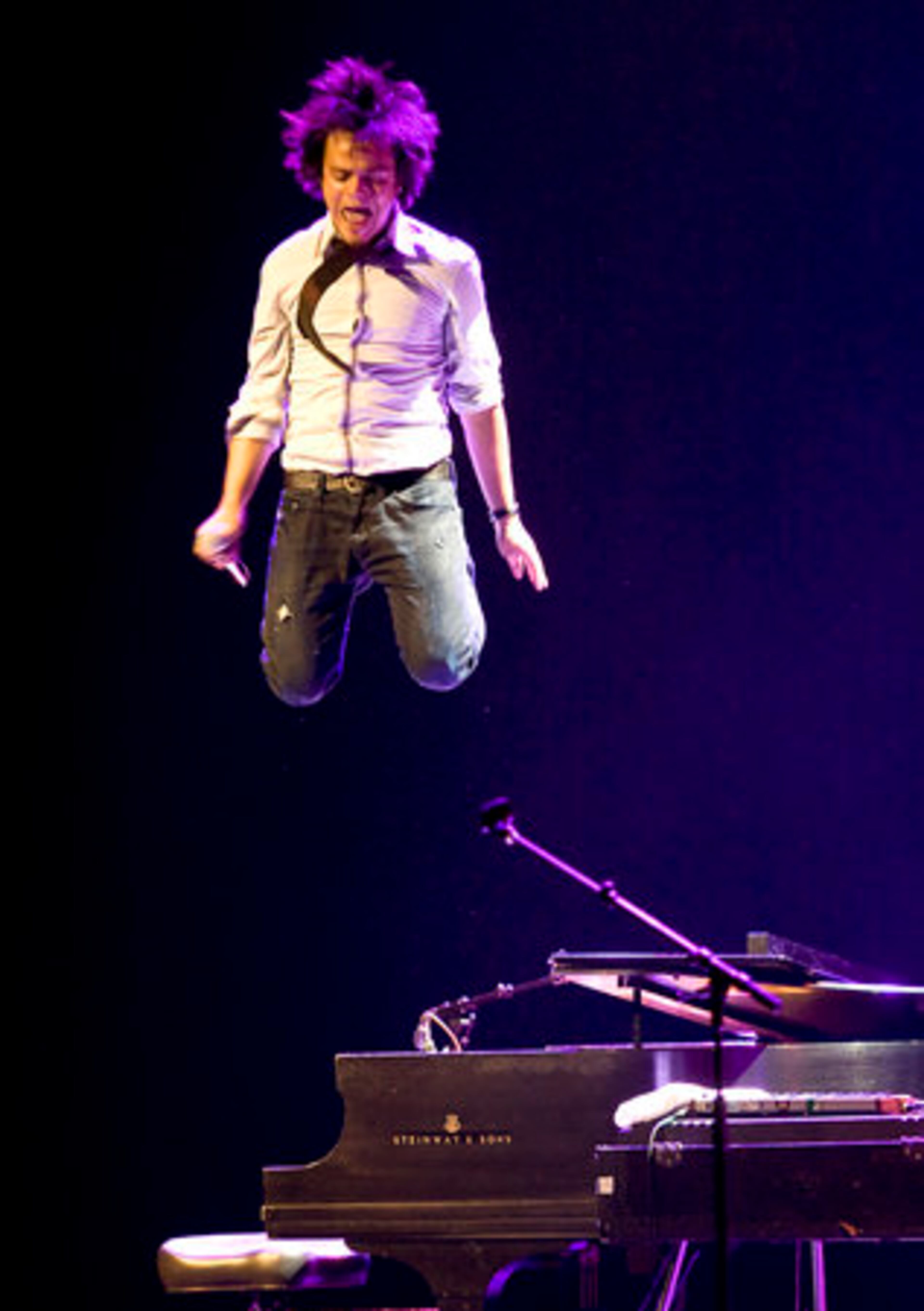 HIGH NOTE: Singer Jamie Cullum leaps off his piano Wednesday after performing at the Montreal International Jazz Festival.