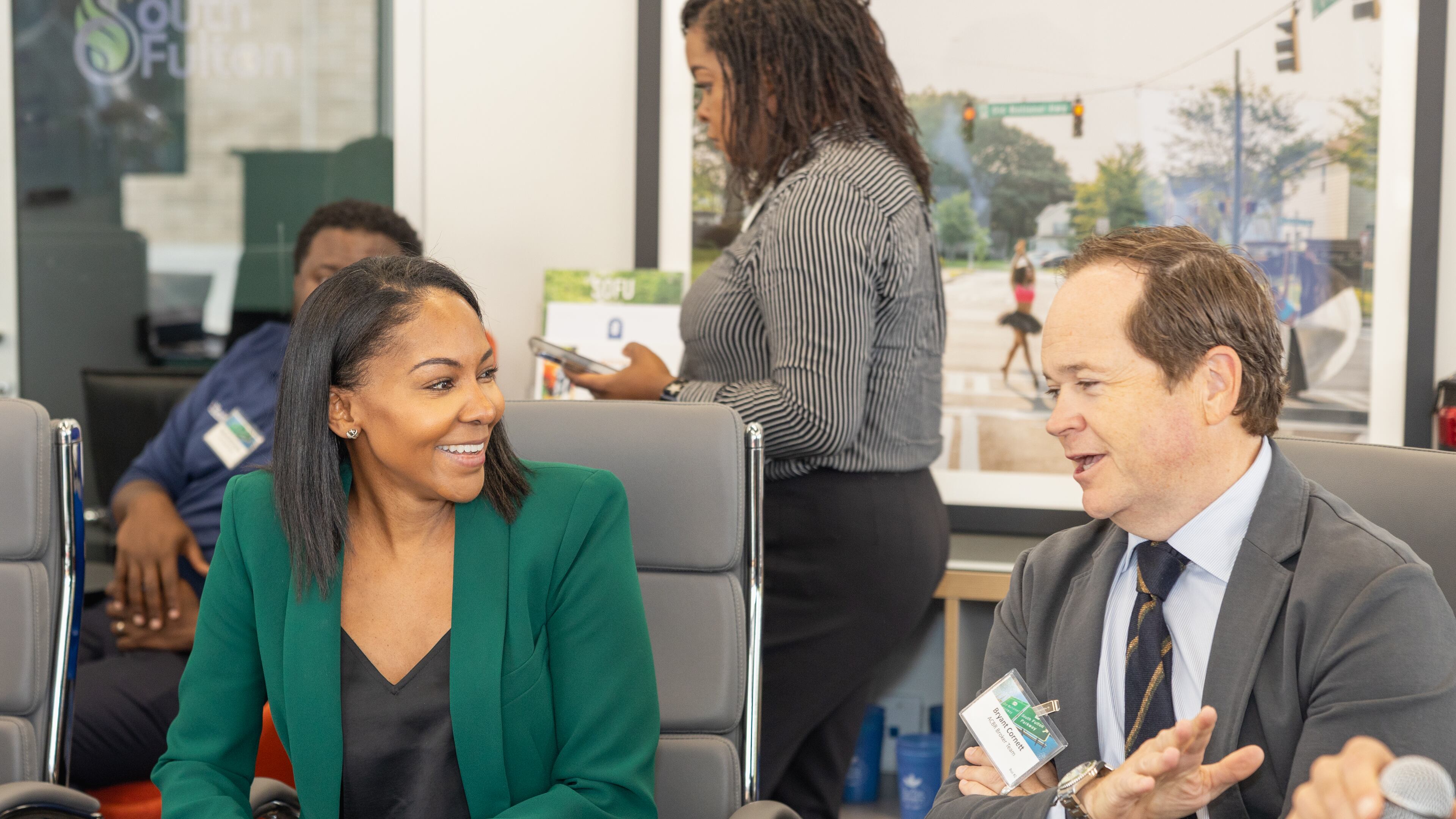 Development Authority of Fulton County Executive Director Sarah-Elizabeth Langford (left) talked to Bryant Cornett, the Atlanta Commercial Board of Realtors education committee chair, on Wednesday, Sept. 27, 2023, during an event to highlight development sites in South Fulton. Image courtesy of The Collaborative Firm.