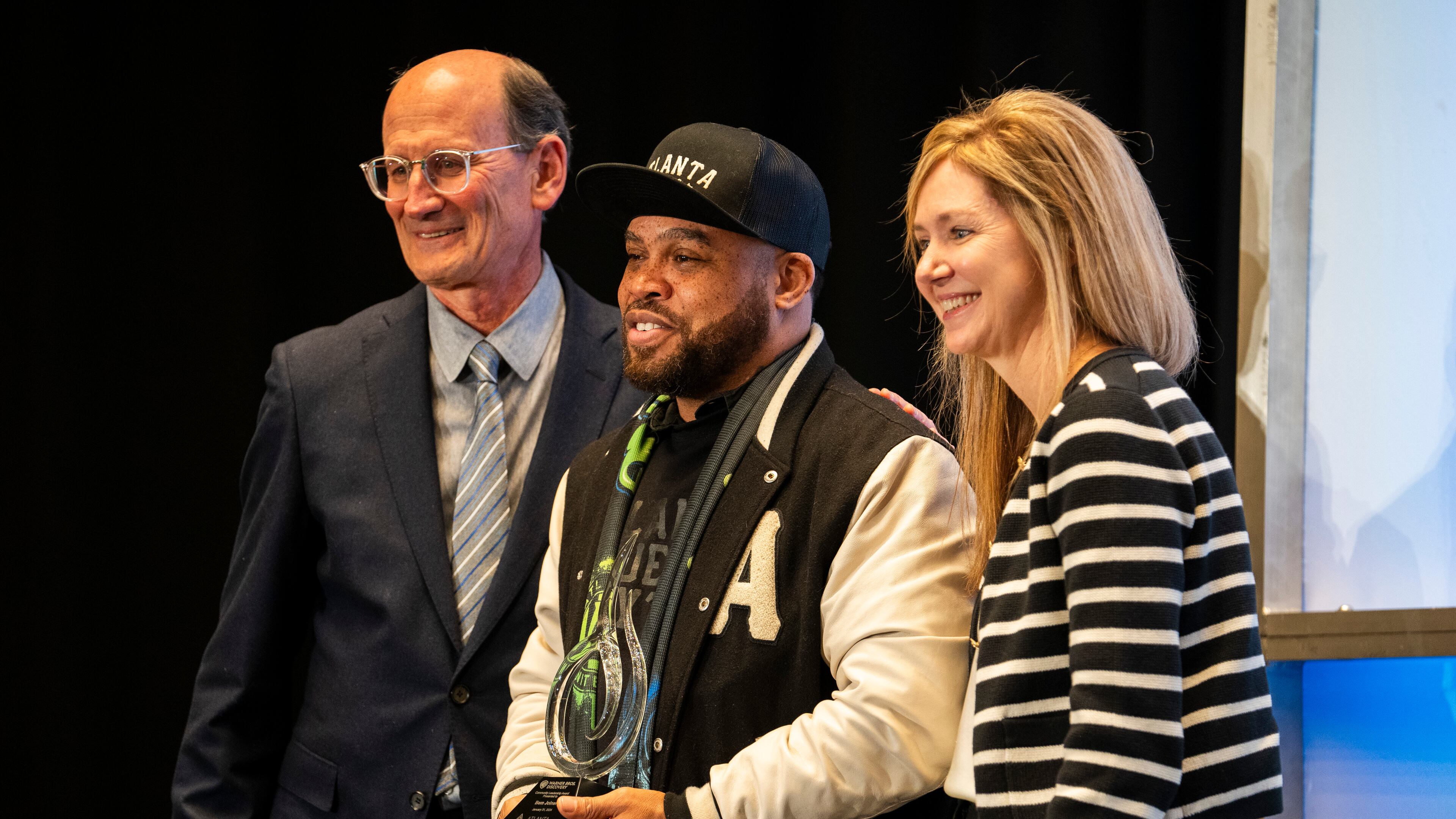 Bem Joiner, creative culture curator and co-founder of Atlanta Influences Everything, is honored with the Warner Bros. Discovery Community Leadership Award during Central Atlanta Progress' Annual Meeting & Awards Celebration in Atlanta, Georgia, on Wednesday, Jan. 31, 2024. Joiner's contributions to the community and commitment to quiet leadership are recognized through this prestigious accolade. (Olivia Bowdoin for the AJC).