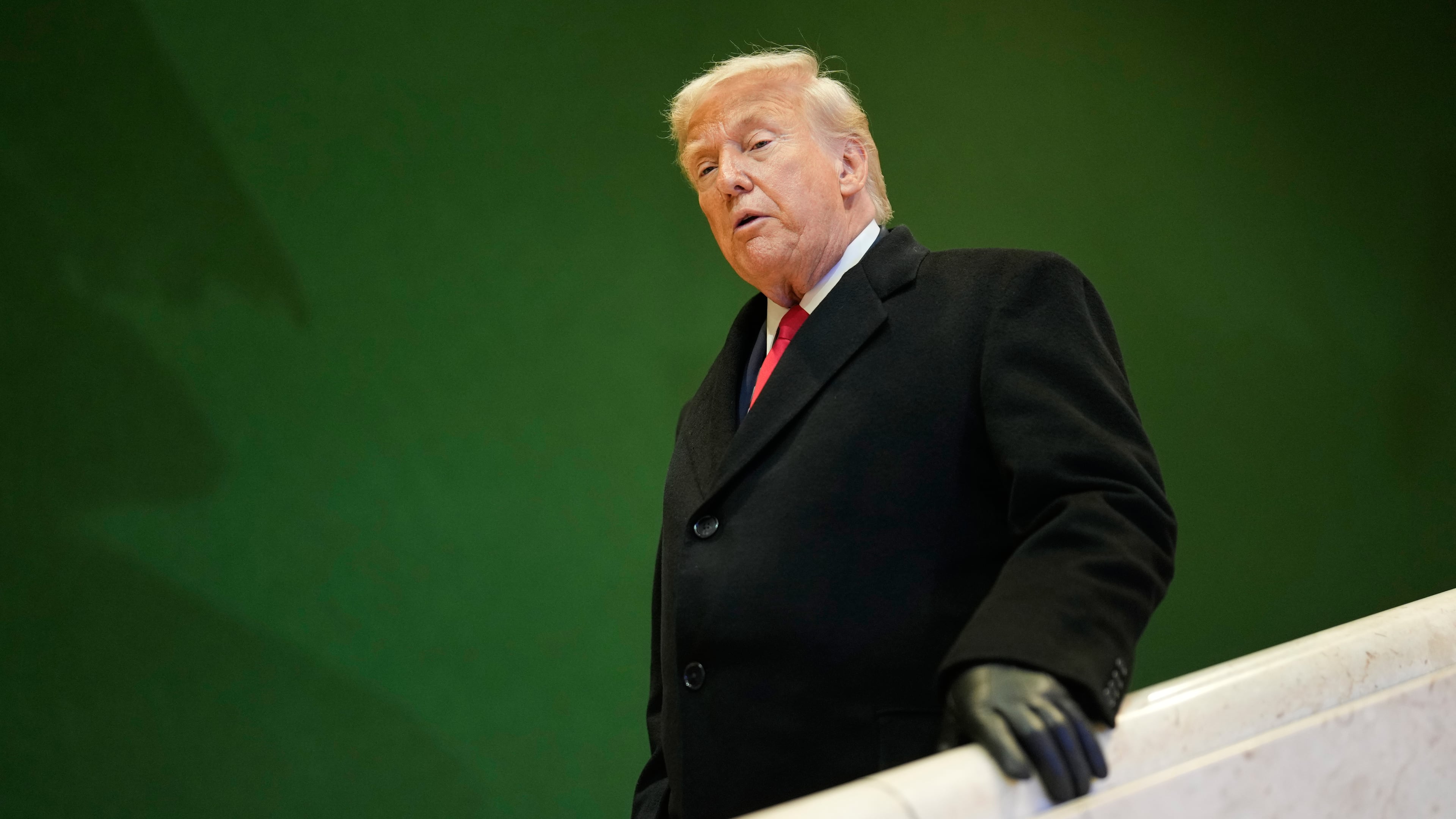 President Donald Trump walks down stairs after a meeting during the Annual Meeting of the World Economic Forum in Davos, Switzerland, Wednesday, Jan. 21, 2026. (AP Photo/Markus Schreiber)