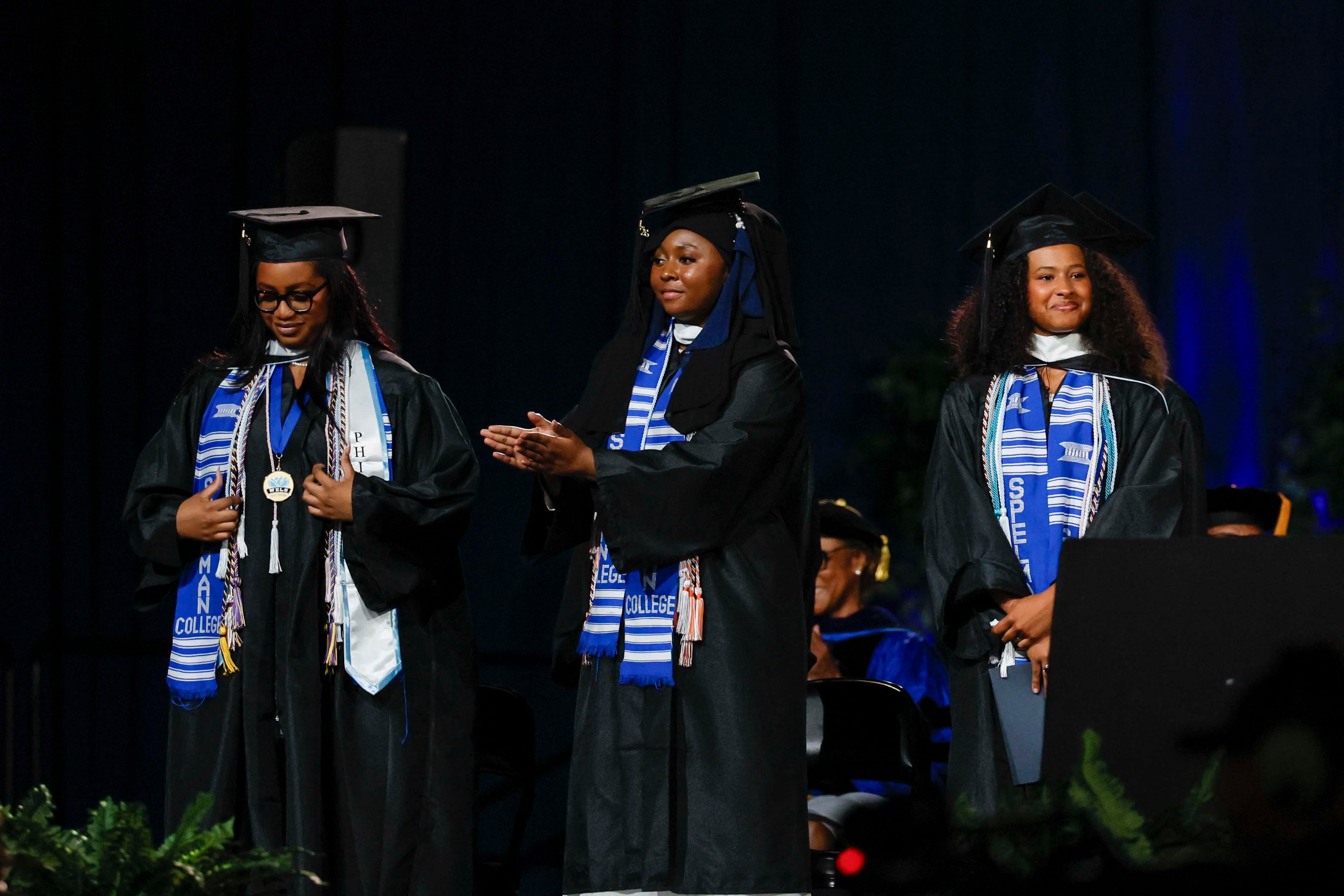 From right to left, Sophia Michelle T. Davis, Mariama Diallo, and Nia-Sarai Madison Perry are part of the historic group of seven valedictorians recognized during the Spelman College Commencement at the Georgia International Convention Center in College Park on Sunday, May 17, 2026. (Miguel Martinez/AJC)