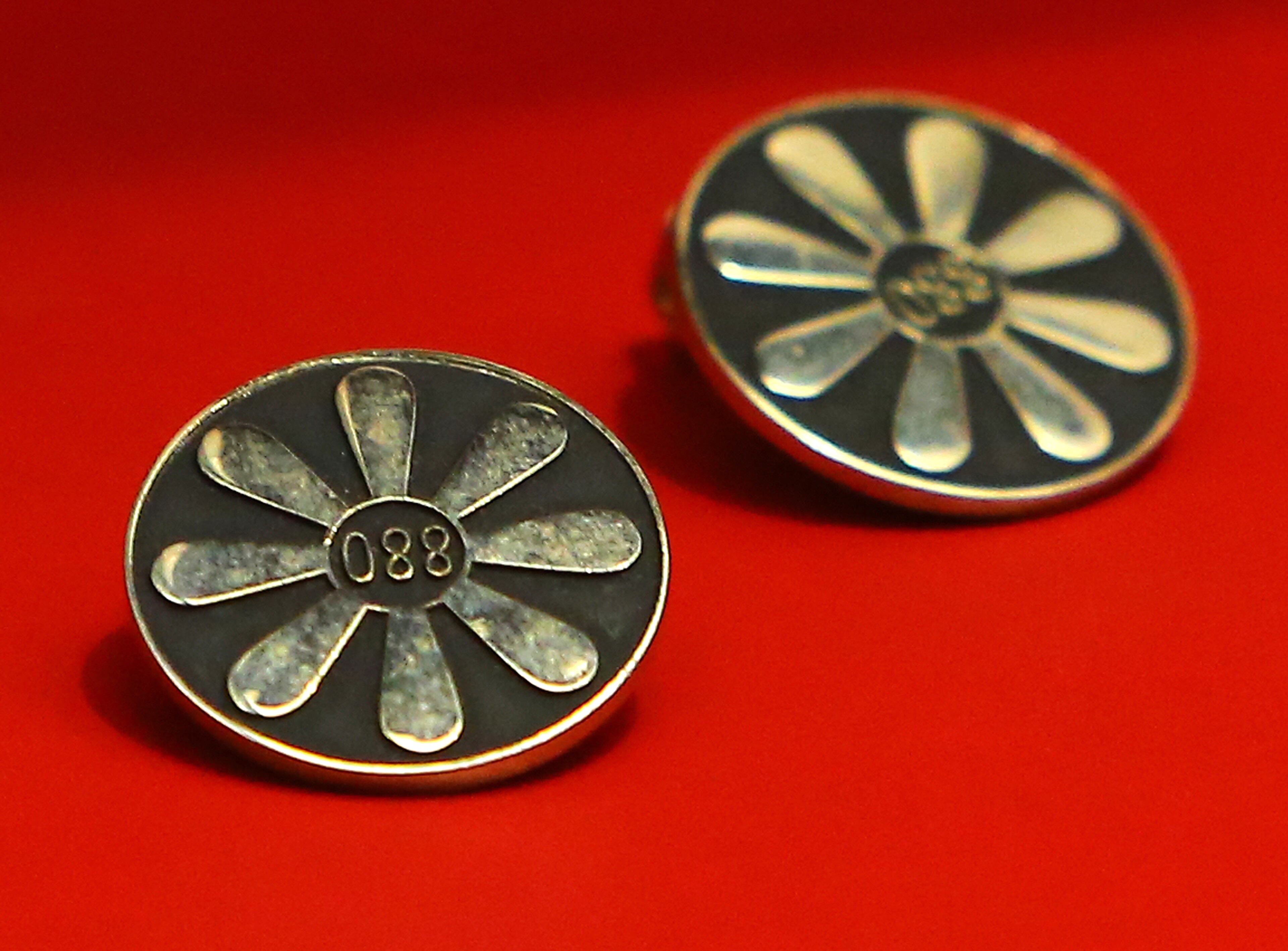 061214 ATLANTA: In 1959 Delta flight attendants wore accessorized earrings fashioned after jet props on display at the Delta Flight Museum on Thursday, June 12, 2014, in Atlanta. CURTIS COMPTON / CCOMPTON@AJC.COM