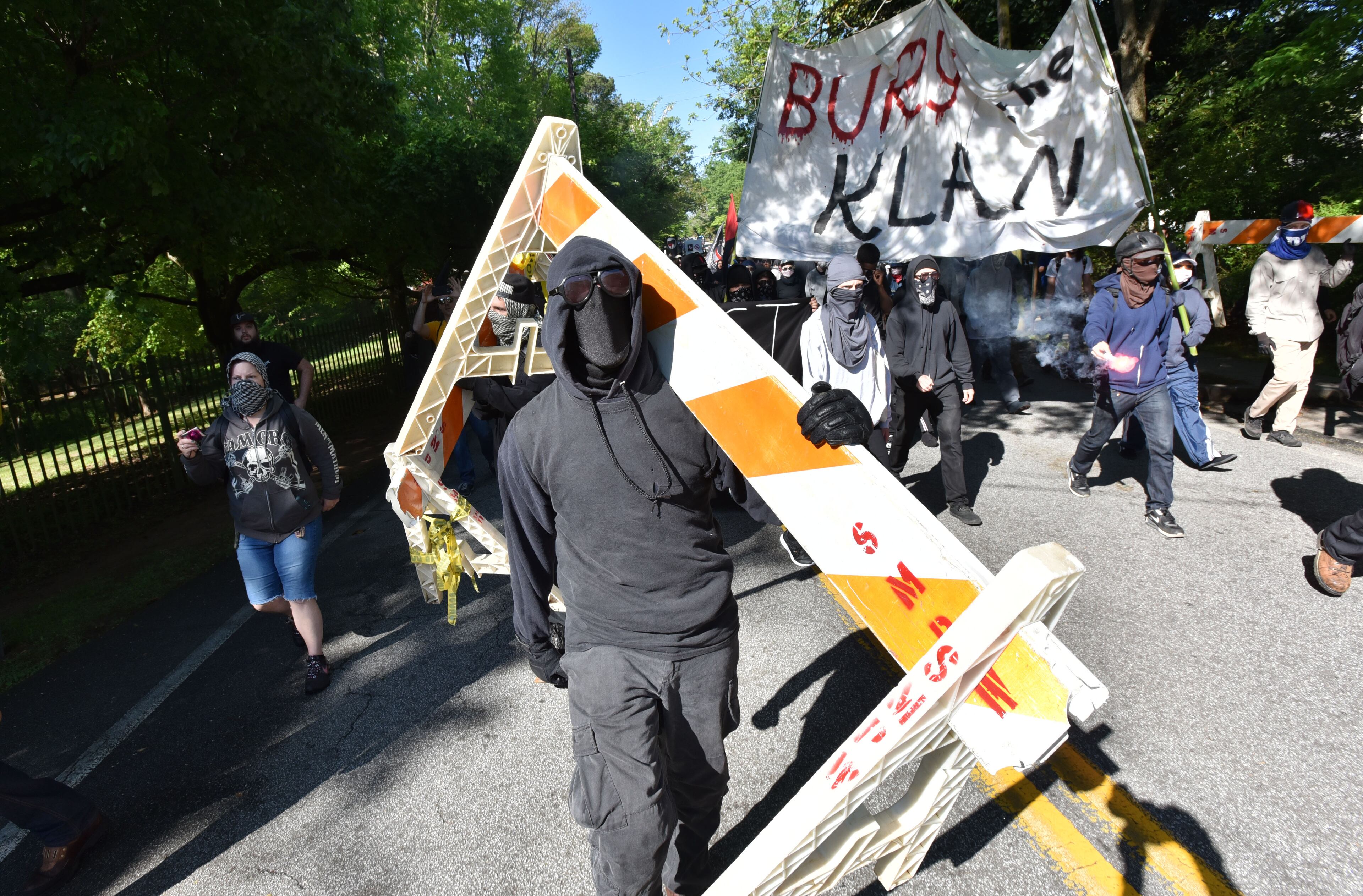 A counter-protester is arrested by police as they try to get past police and to a white power protest at Stone Mountain Park on Saturday, April 23, 2016.