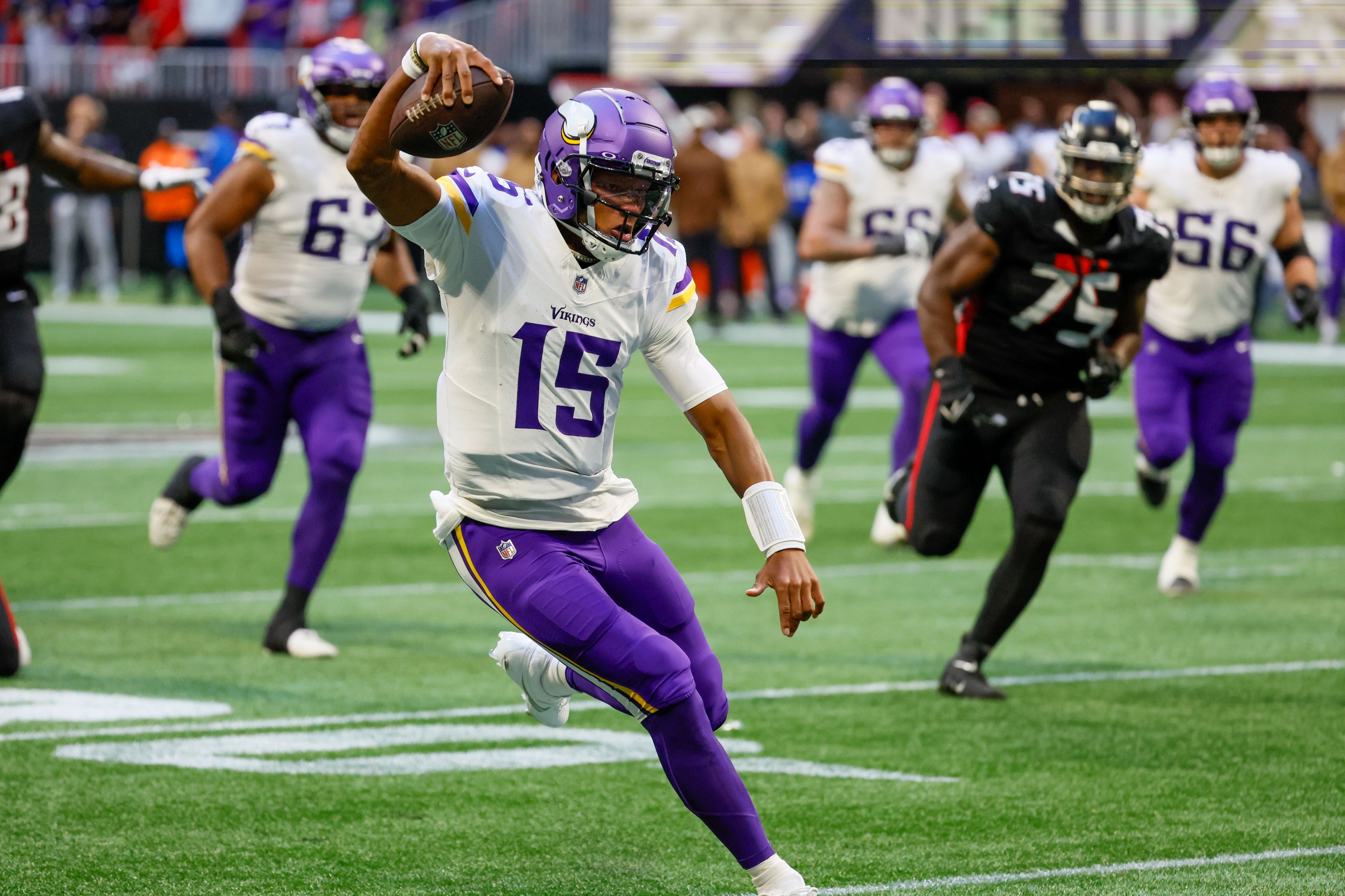 Minnesota Vikings quarterback Joshua Dobbs runs for a first down during the fourth quarter against the Falcons on Sunday, Nov, 5, 2023, at Mercedes-Benz Stadium in Atlanta. Miguel Martinez/miguel.martinezjimenez@ajc.com