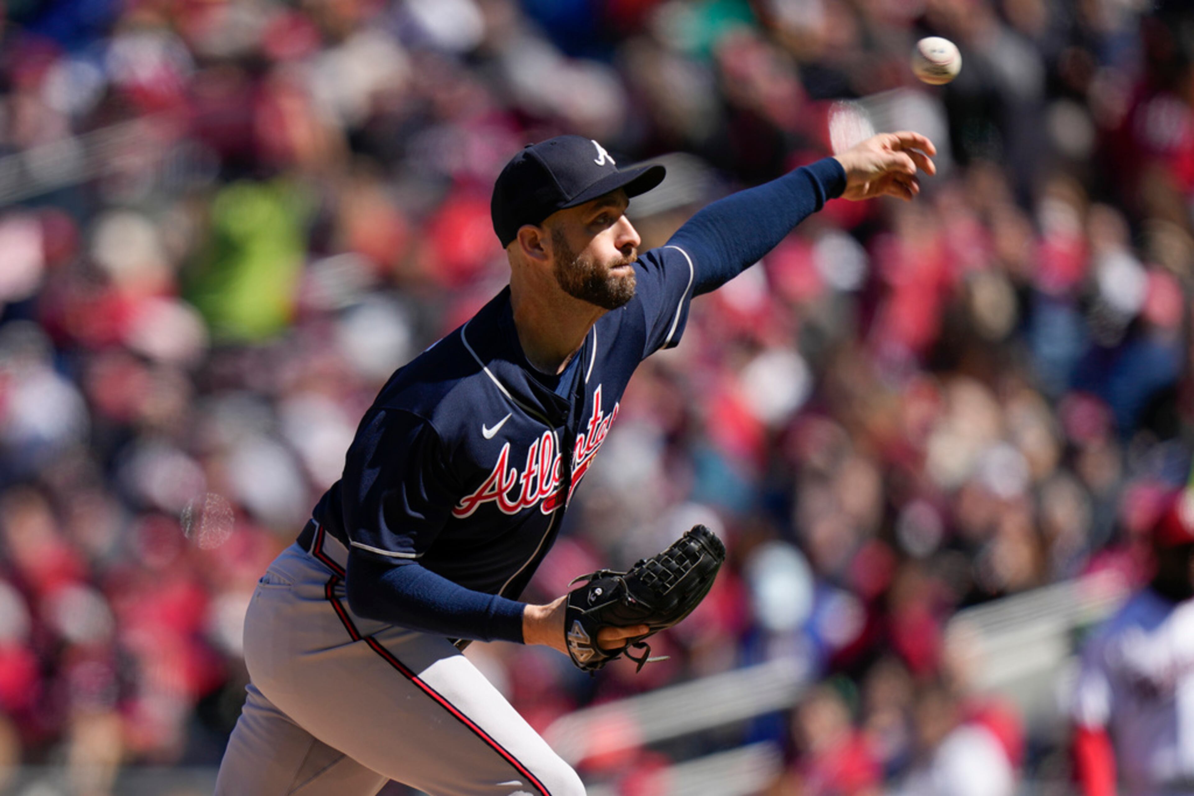 Atlanta Braves relief pitcher Lucas Luetge throws to the Washington Nationals during the fourth inning of an opening day baseball game at Nationals Park, Thursday, March 30, 2023, in Washington. (AP Photo/Alex Brandon)