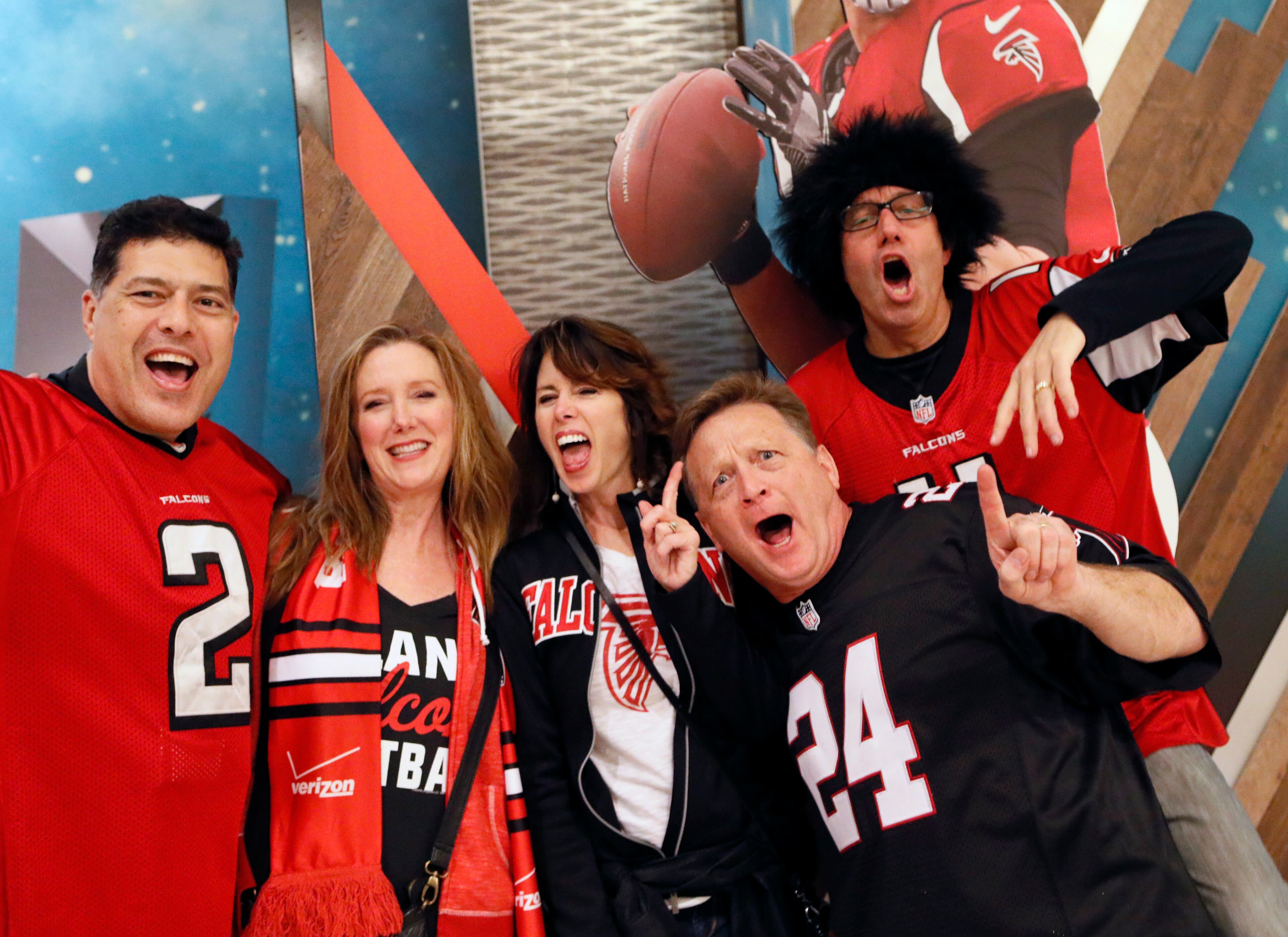 Feb. 4, 2017 - Houston - Leon Shooter (from left), Carol Shooter, Arlene Martinides, Mat Martinides and Andy Shearer have fun and pose for photos by large cardboard displays of Matt Ryan and Tom Brady in the lobby of the Marriott Marquis Hotel. Their group drove to Houston in an RV for the game. Activity around the NFL Experience and the George R. Brown Convention Center on Saturday Feb. 4, 2017, in Houston. BOB ANDRES /BANDRES@AJC.COM