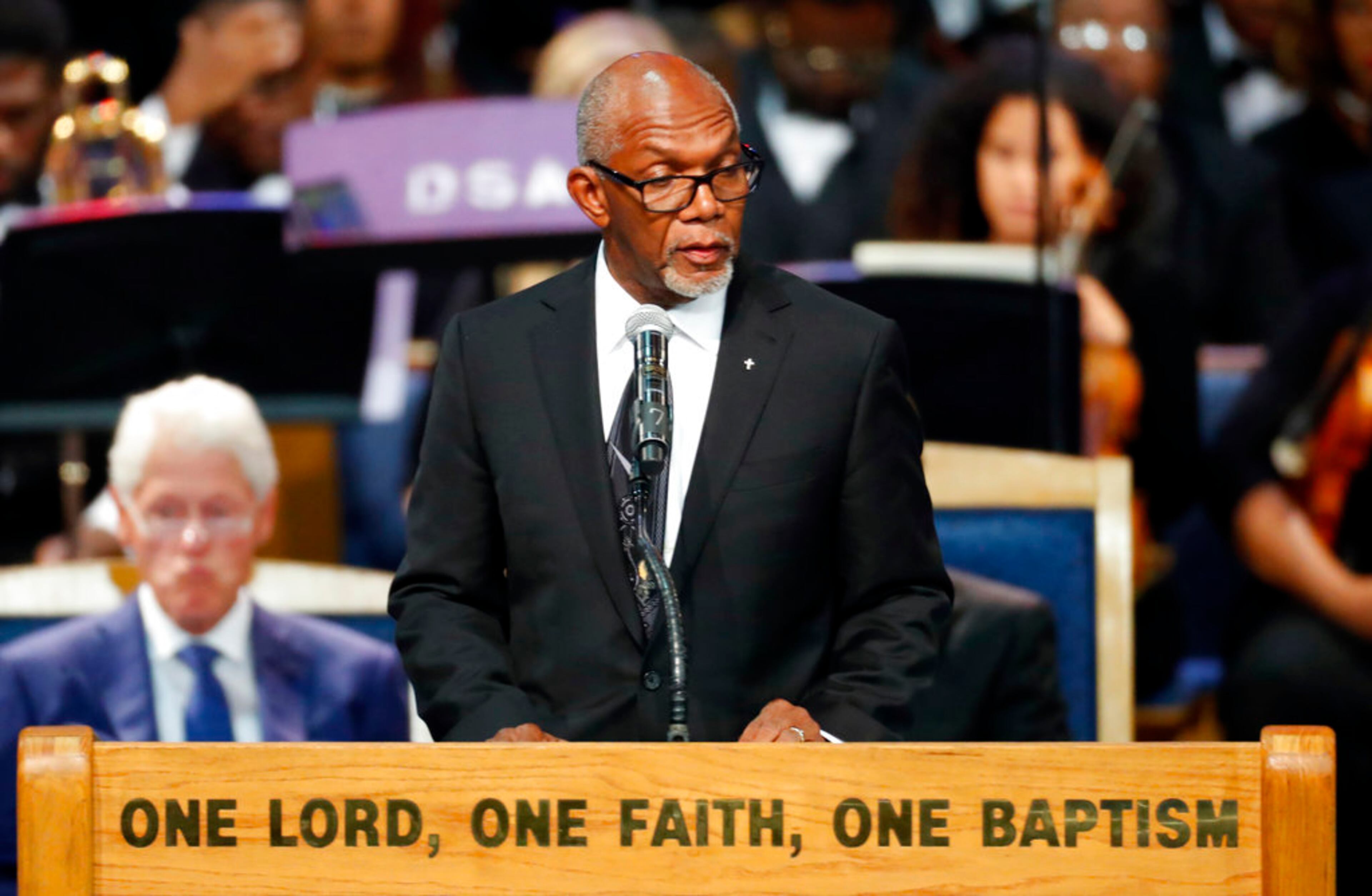 Pastor Dr. E.L. Branch of Third New Hope Church delivers a prayer of comfort during the funeral service for Aretha Franklin at Greater Grace Temple, Friday, Aug. 31, 2018, in Detroit. Franklin died Aug. 16, 2018 of pancreatic cancer at the age of 76. (AP Photo/Paul Sancya)