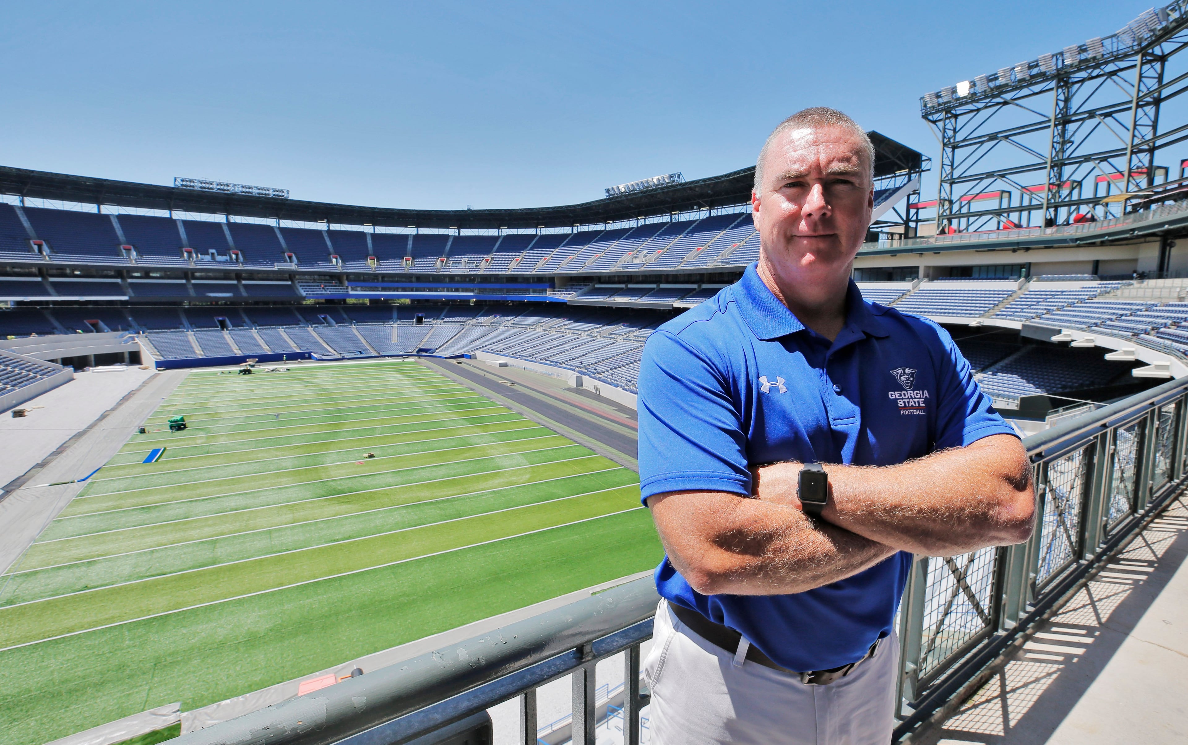 New Georgia State University head football coach Shawn Elliott poses at the site of the Georgia State football stadium, formerly Turner Field.