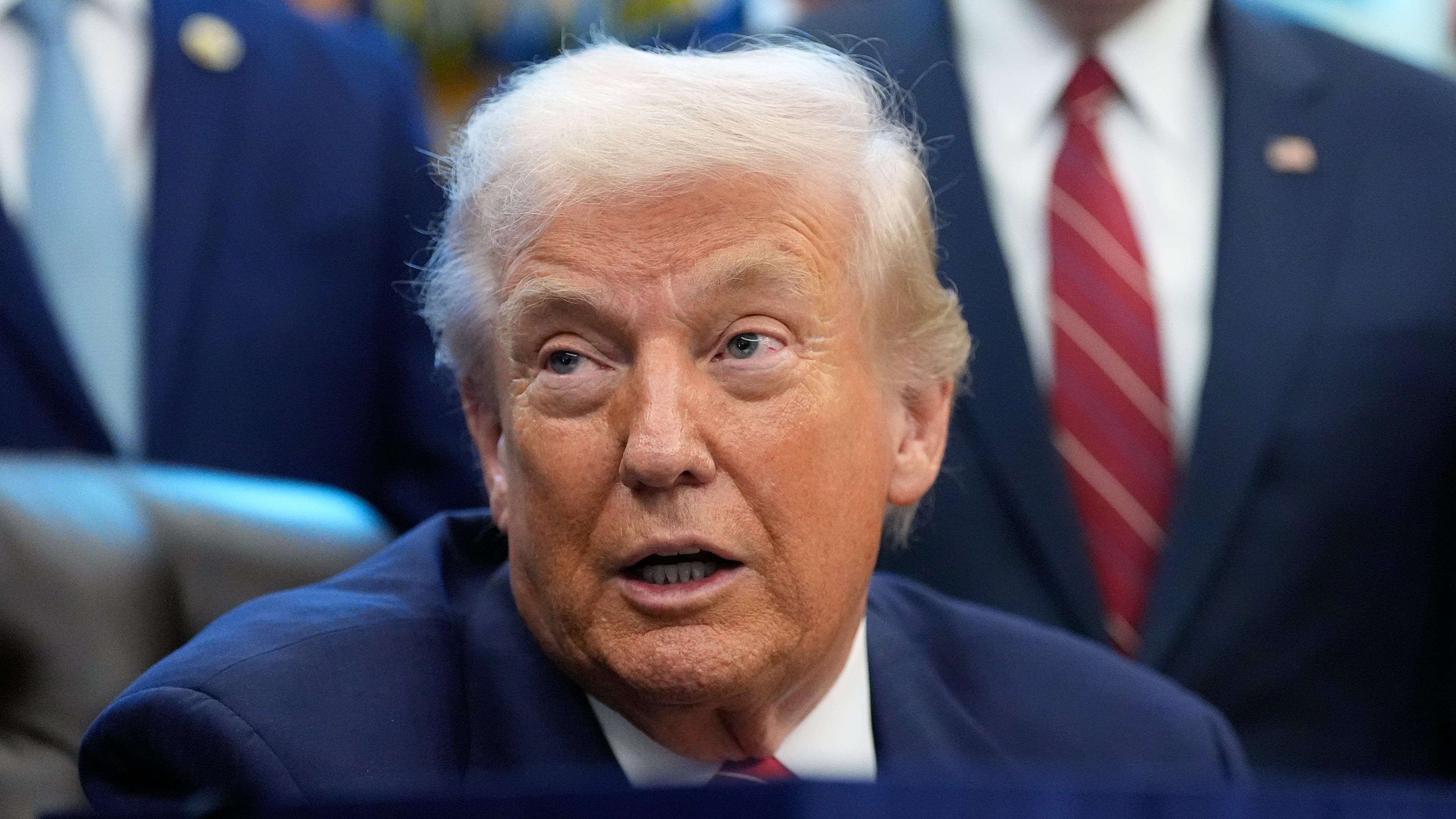 President Donald Trump speaks to reporters after signing a spending bill that ends a partial shutdown of the federal government in the Oval Office of the White House, Tuesday, Feb. 3, 2026, in Washington. (AP Photo/Alex Brandon)