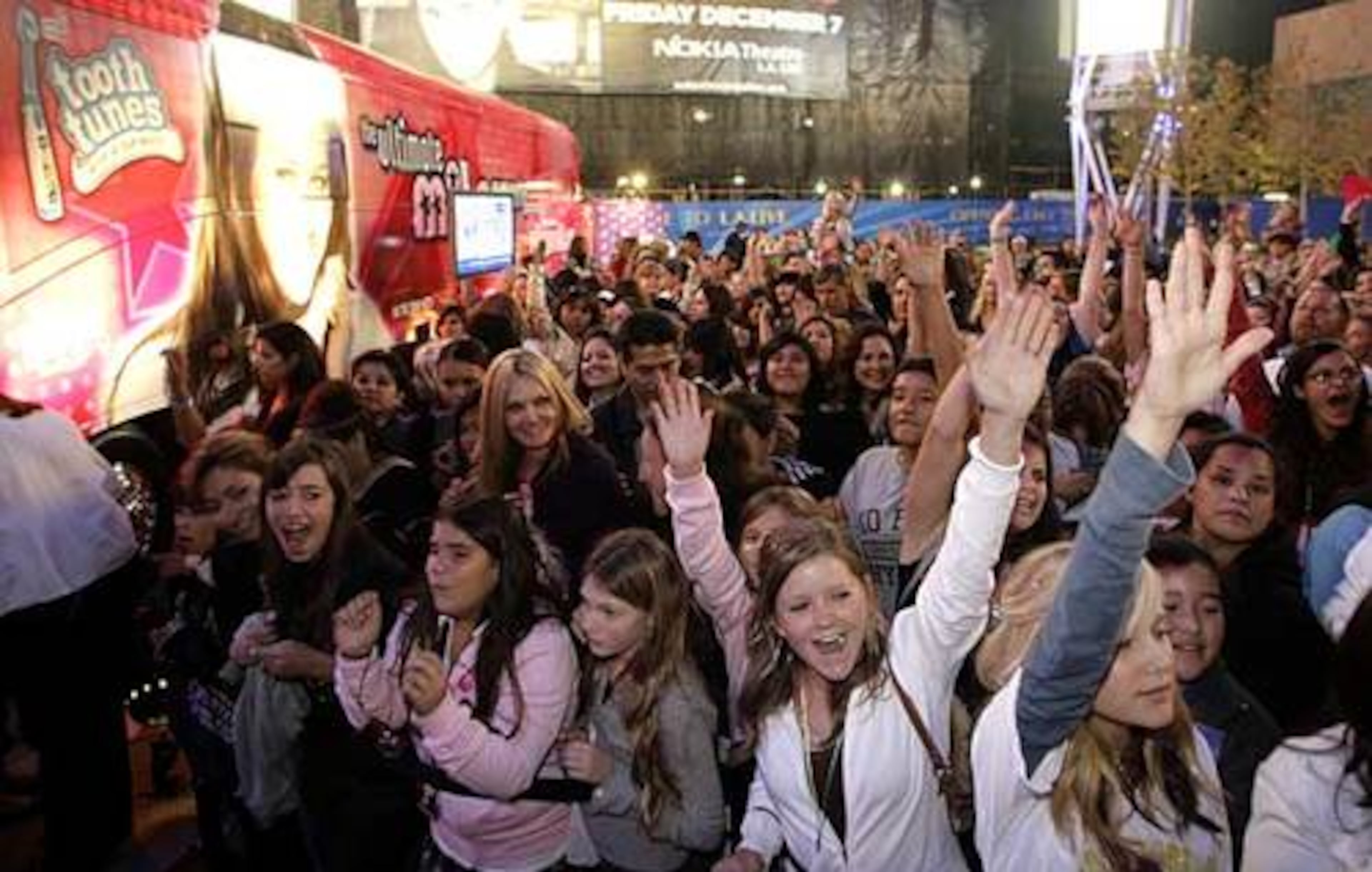 Fans of Miley Cyrus, star of The Disney Channel's series "Hannah Montana," cheer outside her bus at the Ultimate Miley Party Bus Tour 2007 in Los Angeles.