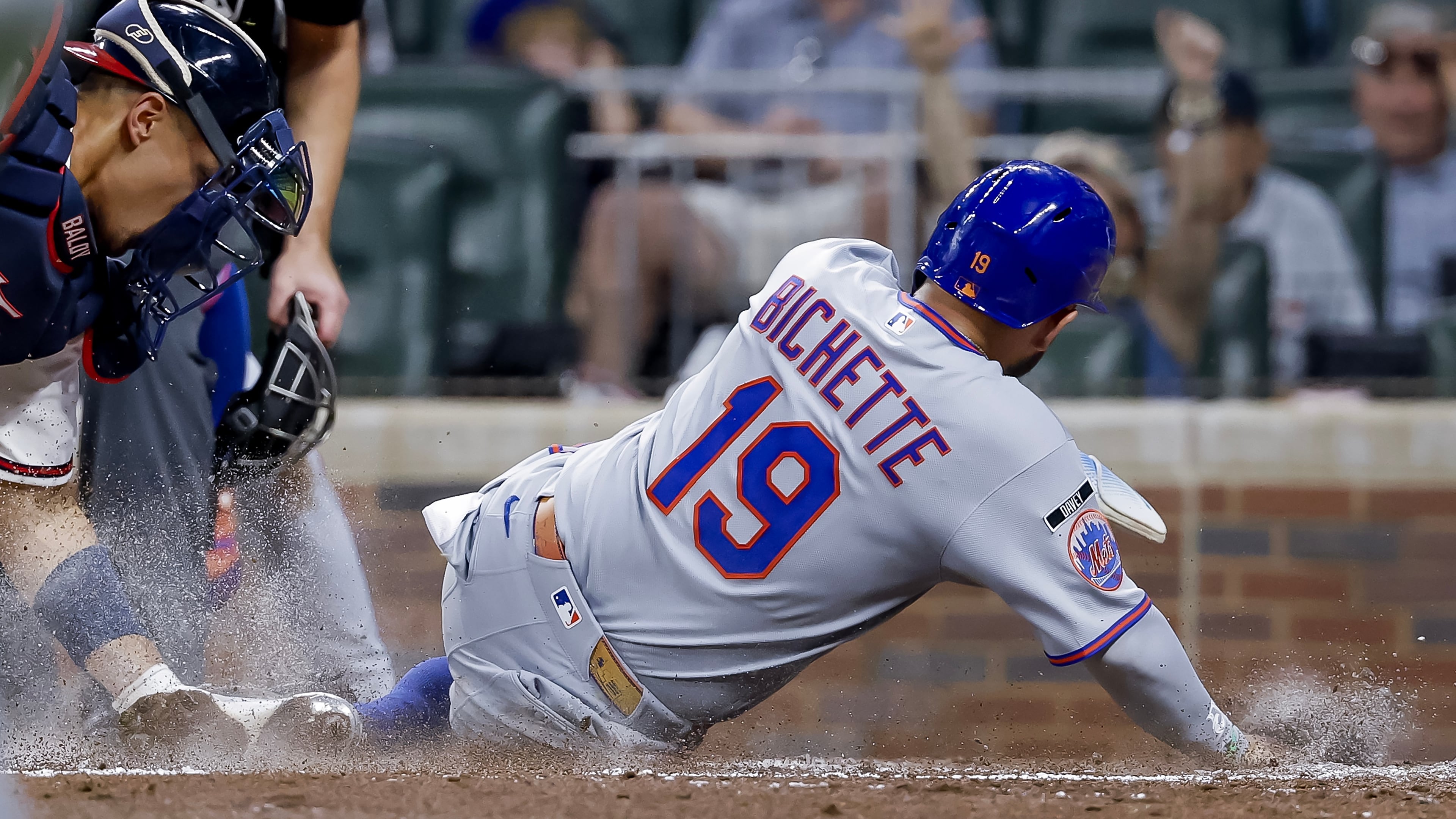 Atlanta Braves catcher Drake Baldwin, left, tags out New York Mets' Bo Bichette (19) at home plate during the sixth inning of a baseball game, Monday, July 6, 2026, in Atlanta. (AP Photo/Erik S. Lesser)