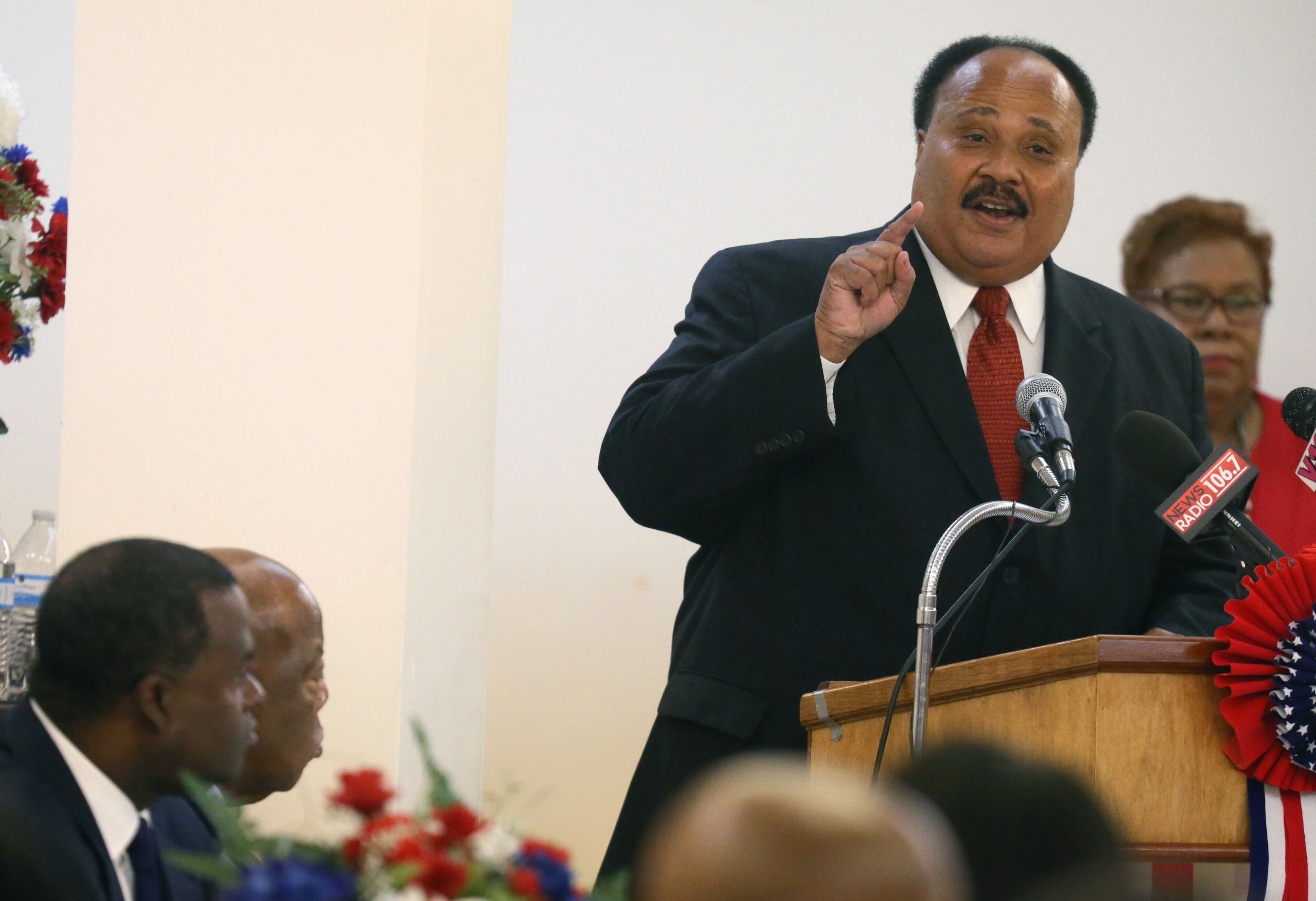 Martin Luther King III delivers opening remarks at the luncheon as Atlanta Mayor Kasim Reed (left) and U. S. Rep. John Lewis look on. Andrew Young, Dr. Joseph Lowery, the Rev. Jesse Jackson, Martin Luther King III and U.S. Rep. John Lewis attended the 50th Observance of the Struggle for the 1965 Voting Rights Act Luncheon at the Wheat Street Baptist Church on Aug. 4, 2015. BOB ANDRES / BANDRES@AJC.COM