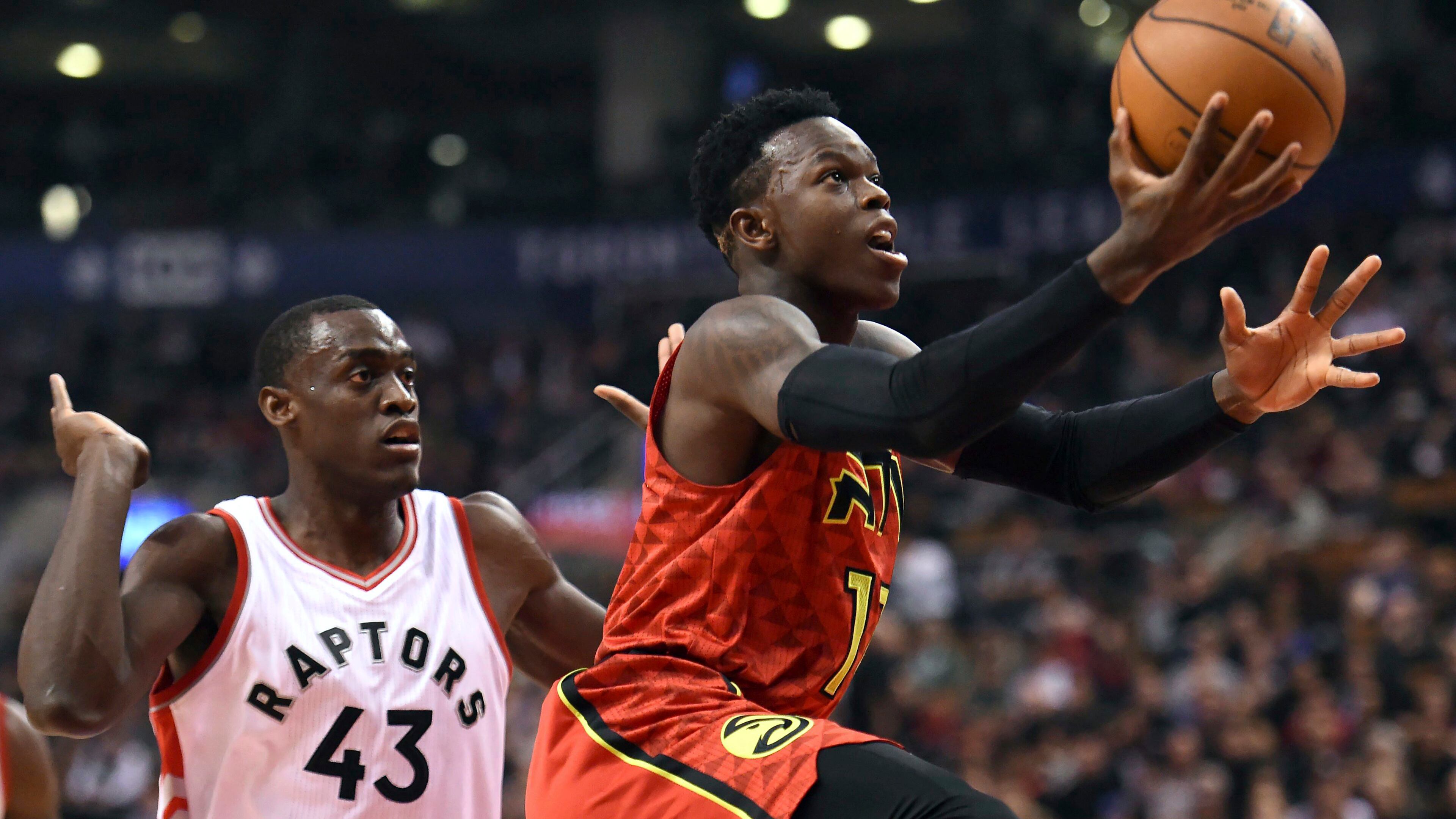 Atlanta Hawks guard Dennis Schroder (17) goes to the basket as Toronto Raptors forward Pascal Siakam (43) defends during the first half of an NBA basketball game Saturday, Dec. 3, 2016, in Toronto. (Frank Gunn/The Canadian Press via AP)