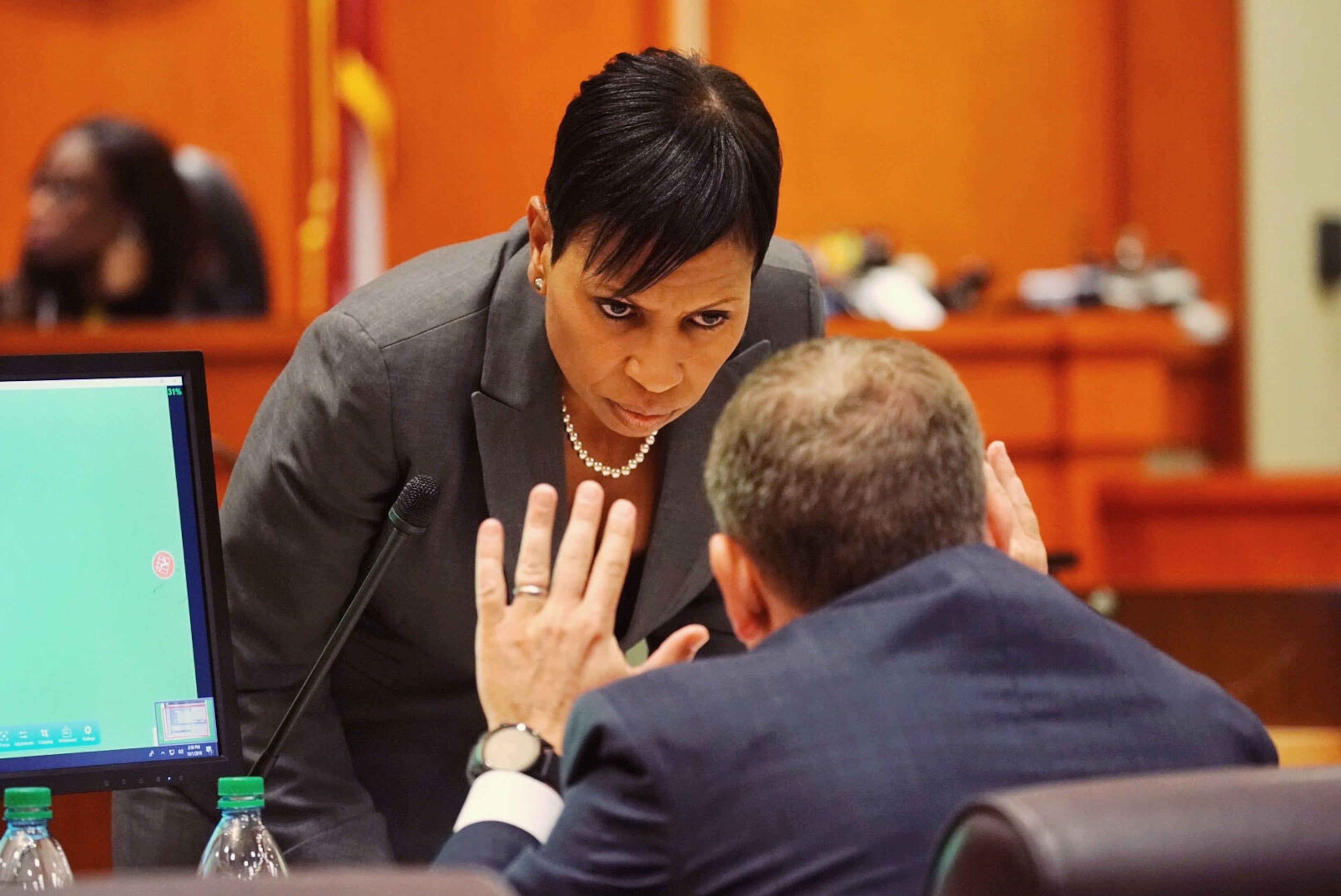 Lead prosecutor Buffy Thomas confers with fellow prosecuting attorney Lance Cross during day three of the Robert Olson murder trial at the DeKalb County Courthouse on October 1, 2019 in Decatur. Olsen is charged with murdering war veteran Anthony Hill. (Elijah Nouvelage for The Atlanta Journal Constitution)