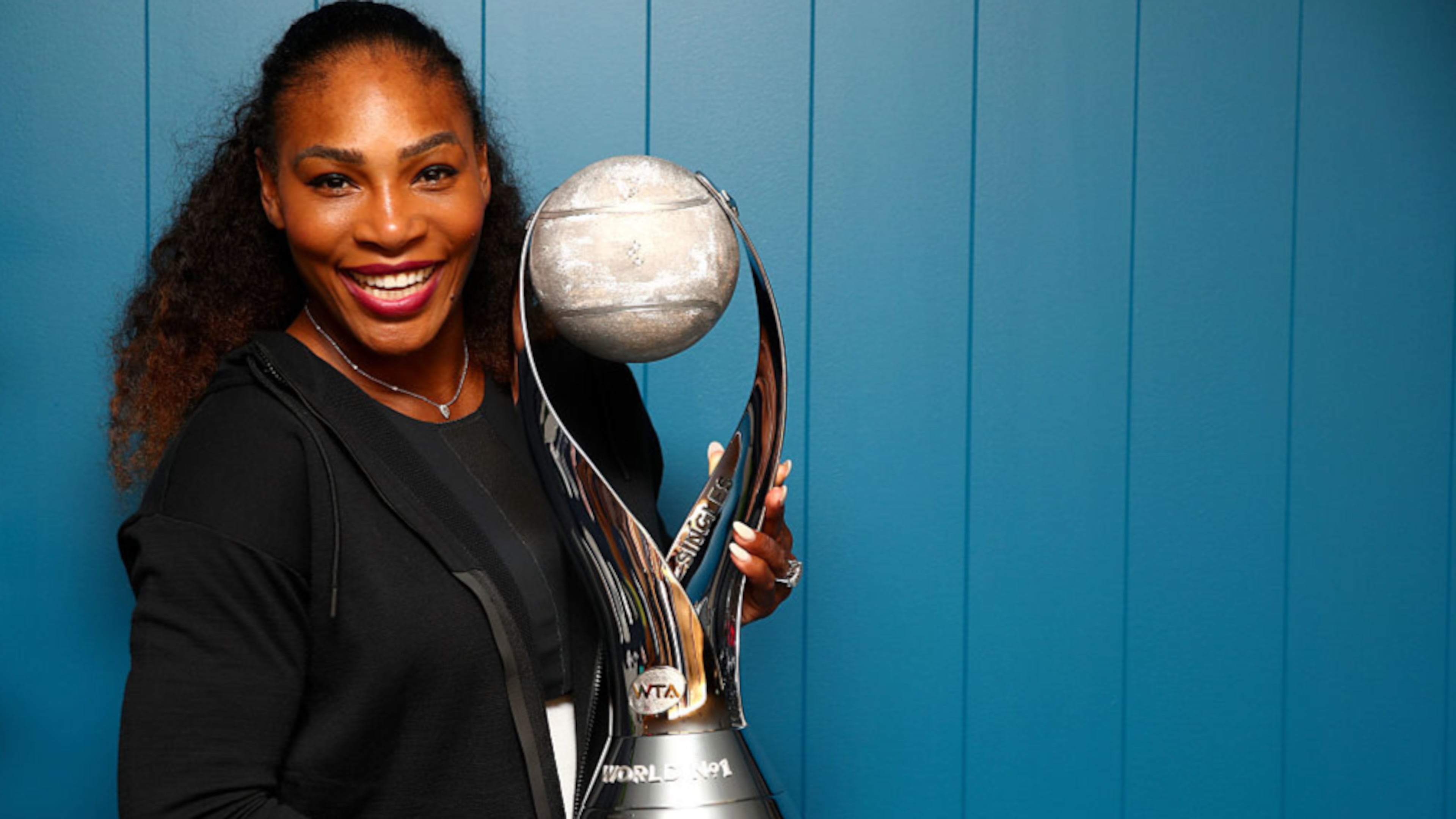 MELBOURNE, AUSTRALIA - JANUARY 28: Serena Williams of the United States poses with the WTA world No.1 trophy after winning the Women's Singles Final against Venus Williams of the United States on day 13 of the 2017 Australian Open at Melbourne Park on January 28, 2017 in Melbourne, Australia. (Photo by Clive Brunskill/Getty Images)