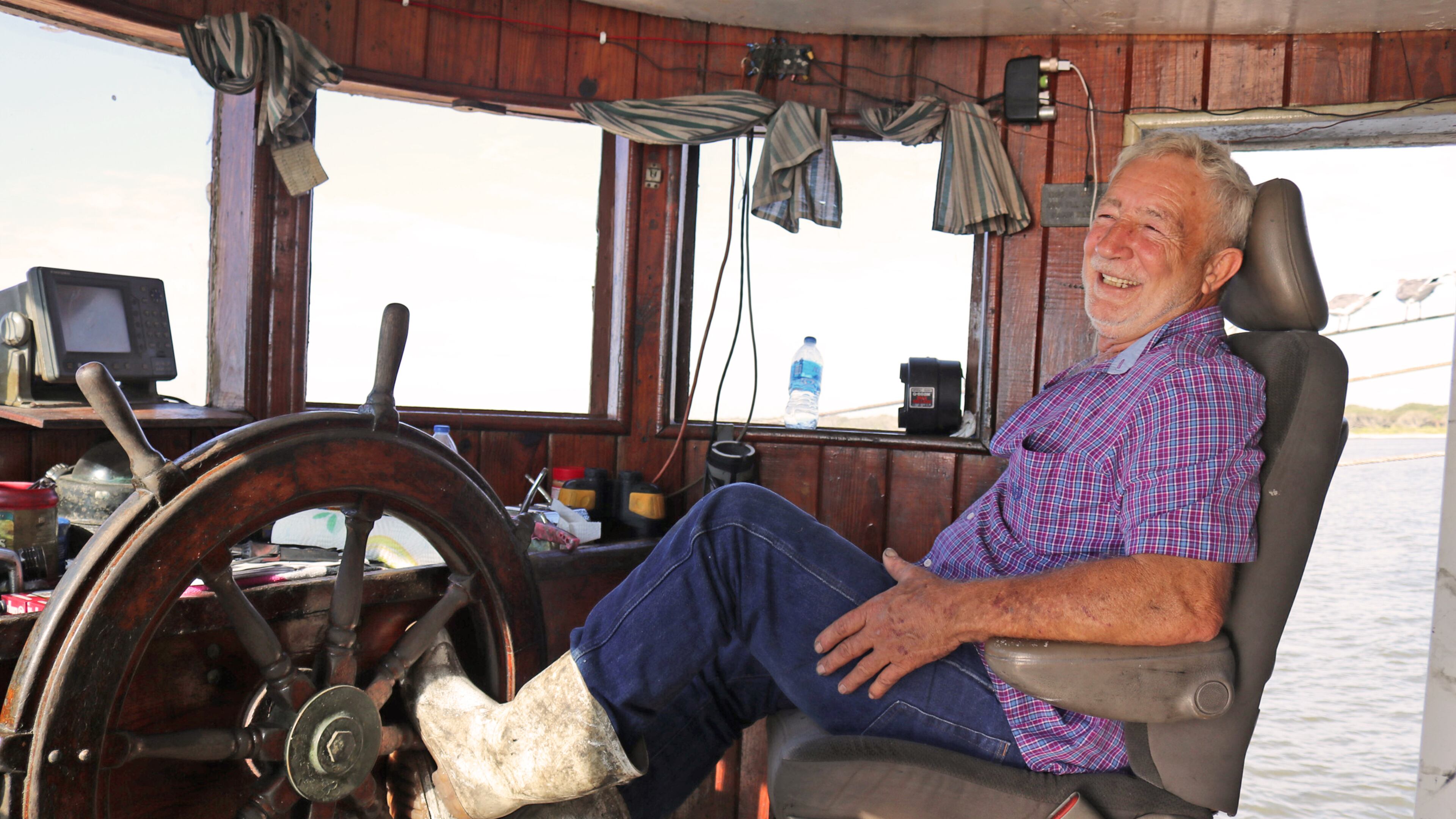 Capt. Eddie Poppell behind the wheel of the Sea Fox shrimp trawler.
Contributed by Eric Dusenbery