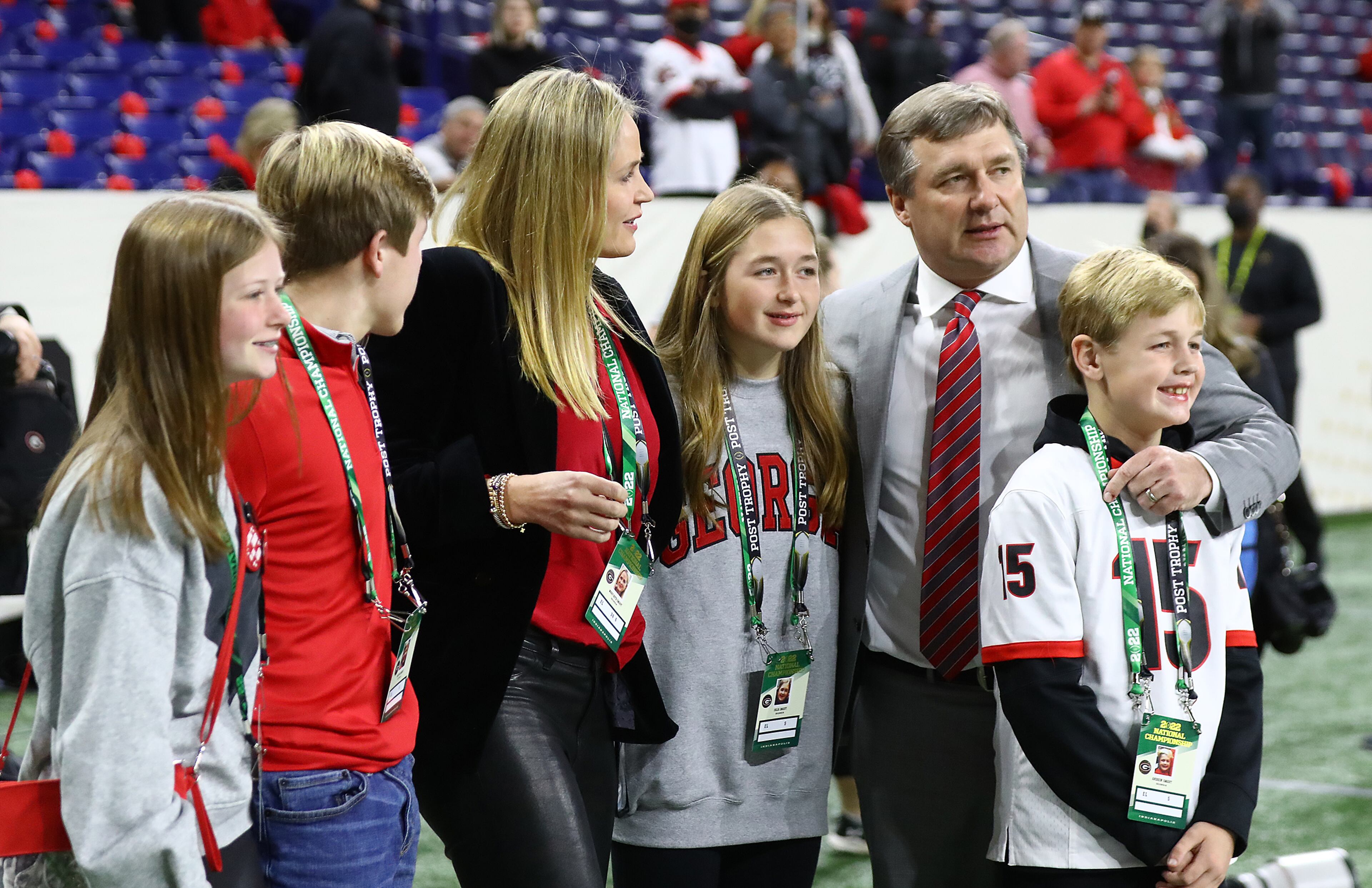 Georgia head coach Kirby Smart pauses to see his wife and children after arriving to play Alabama in the College Football Playoff Championship game on Monday, Jan. 10, 2022, in Indianapolis. “Curtis Compton / Curtis.Compton@ajc.com”`