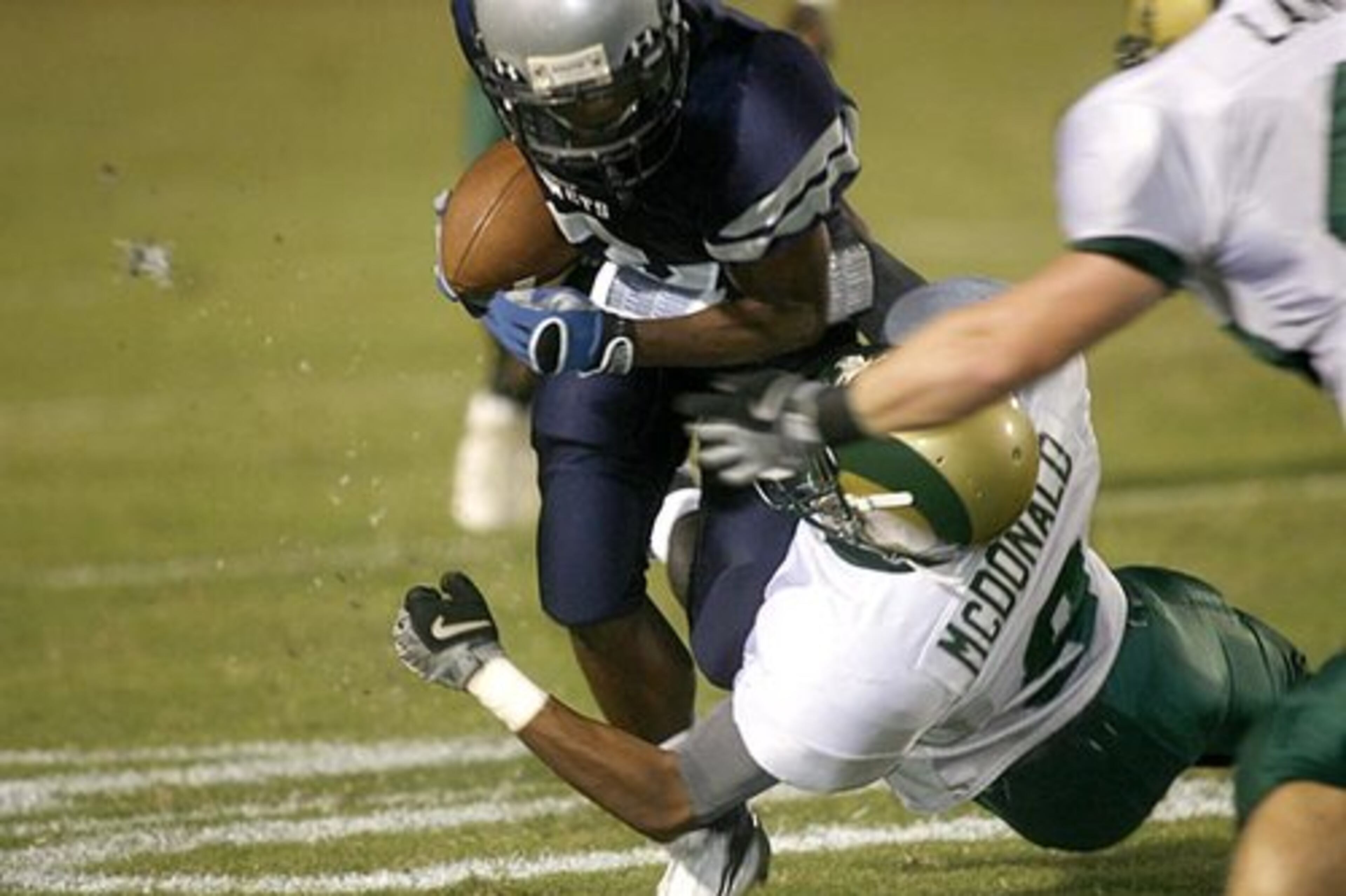 Grayson's Justin McDonald (9) takes down South Gwinnett's Derrick Brown (3) in first half action.