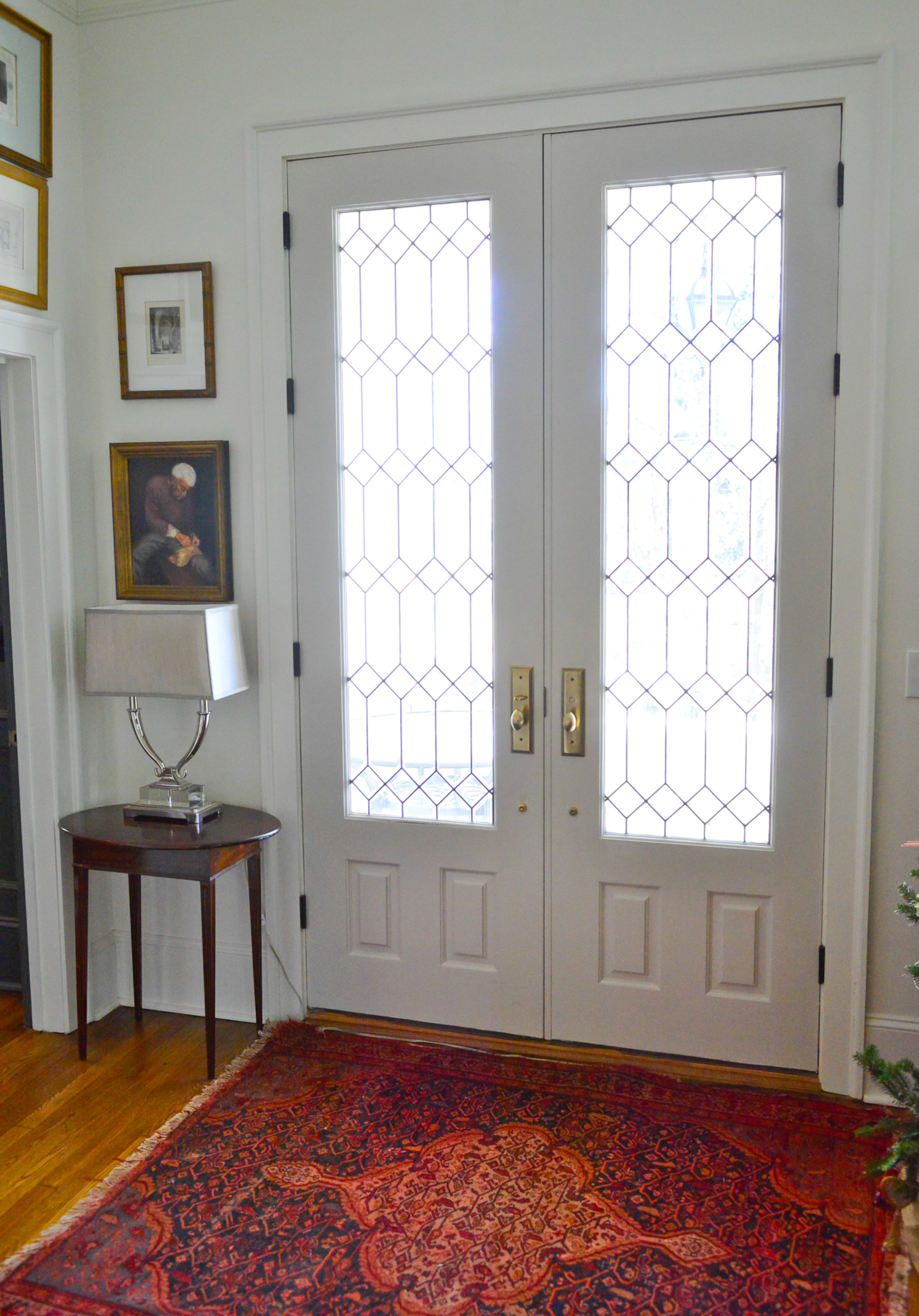 Laura Graham's grandmother found the leaded 9-foot mahogany glass front doors that they installed in their Decatur home. The doors are a favorite design item and an excellent fit for the home, which has 11-foot ceilings.