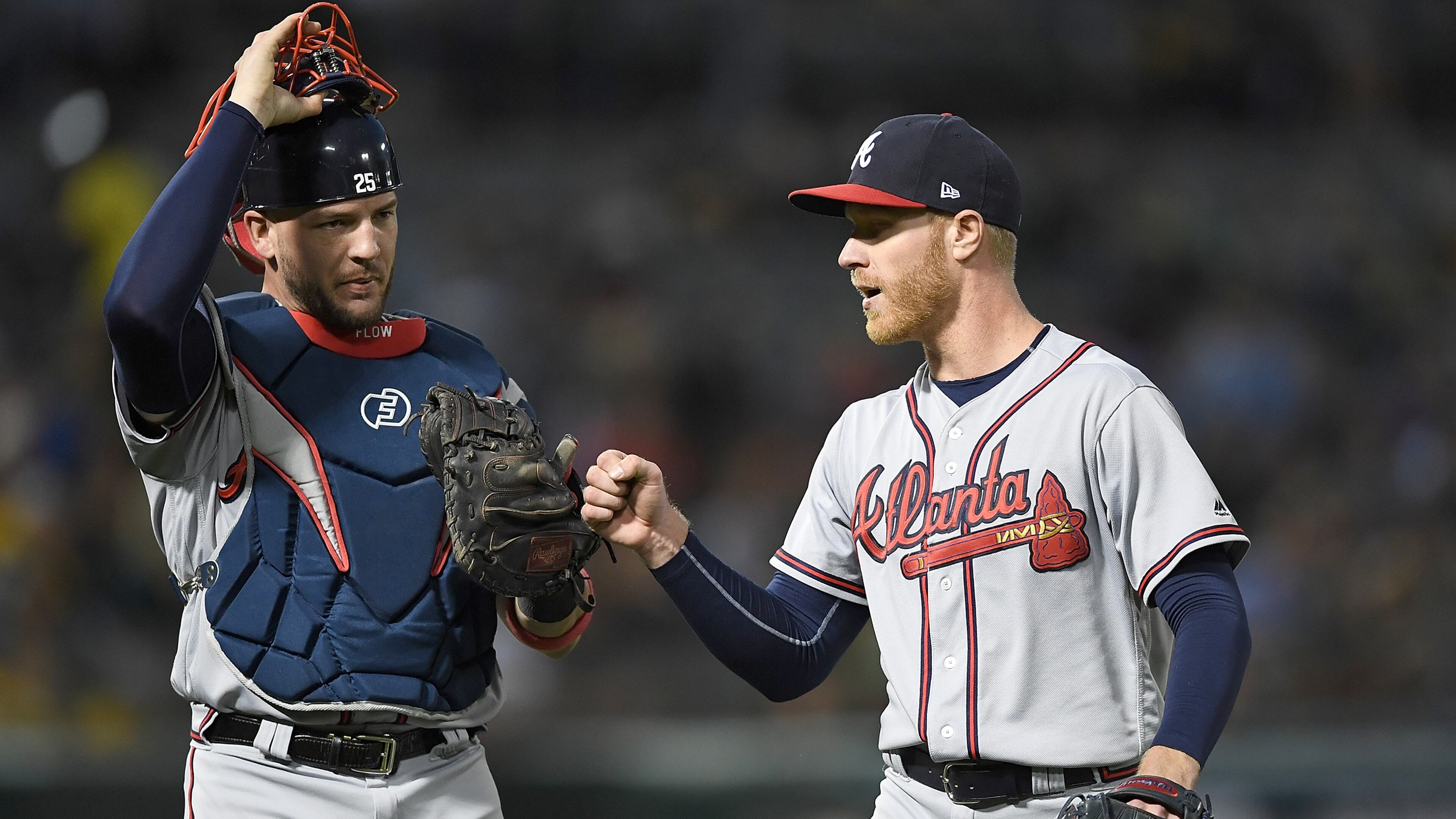 Catcher Tyler Flowers of the Braves taps glove to fist with pitcher Mike Foltynewicz after Foltynewicz stuck out Jed Lowrie of the Oakland Athletics to end the six inning at Oakland Alameda Coliseum on June 30, 2017 in Oakland, California. (Photo by Thearon W. Henderson/Getty Images)