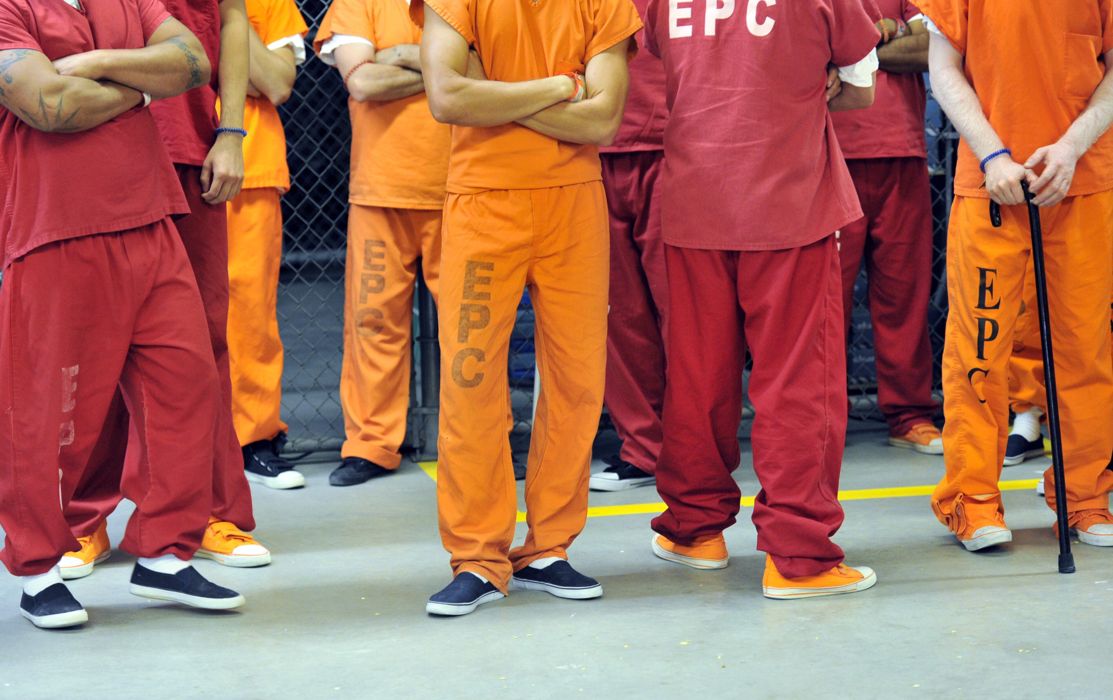 El Paso, Texas - The detainees are issued different colored uniforms based on their criminal records at the El Paso Processing Center in El Paso, Texas on Friday, September 27, 2013. Red indicates they were convicted of serious crimes, such as murder, rape and robbery. Orange uniforms are for less serious offenders, including those who have committed theft or drug-related offenses. Those who have committed only immigration-related offenses wear dark blue. This bustling border city is both a gateway for illegal immigrants and the last stop many see before they are deported. Before they are expelled from the U.S., many illegal immigrants are held at the El Paso Processing Center, a razor wire-rimmed detention facility next to the city airport. HYOSUB SHIN / HSHIN@AJC.COM